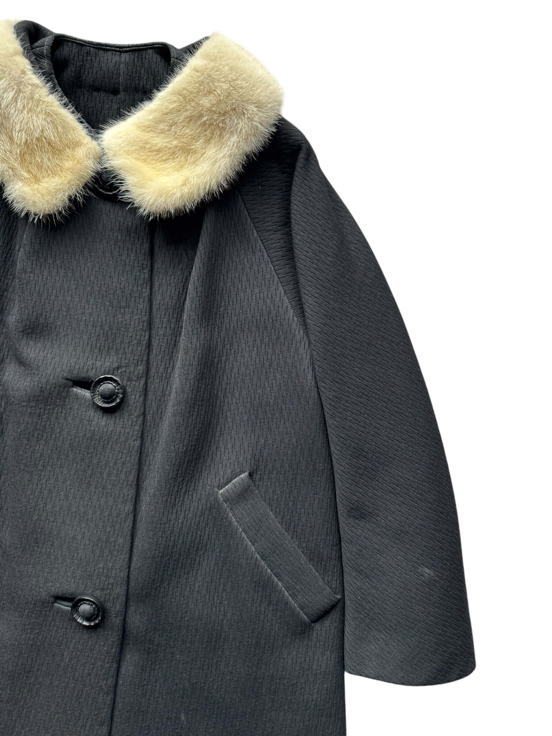 Front left arm view of 1960s Black Coat with Mink Collar M-L