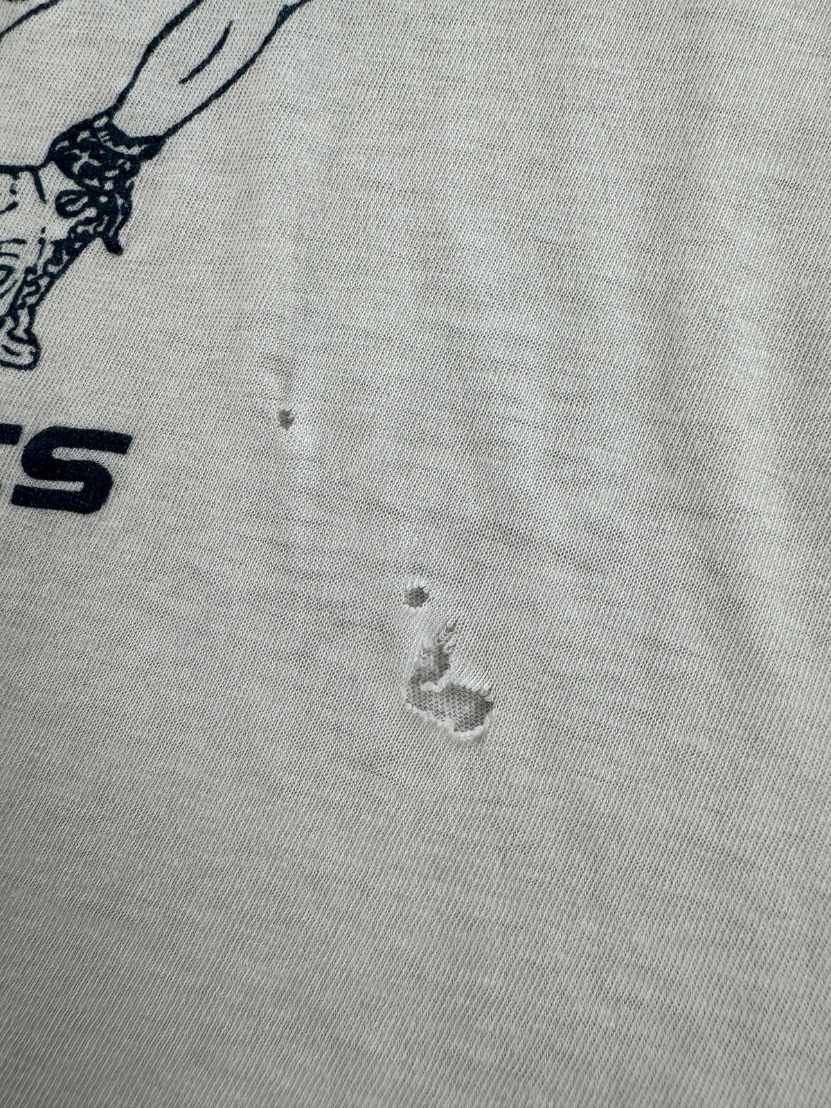 Small holes on front of Vintage Wrestling Tee SZ M