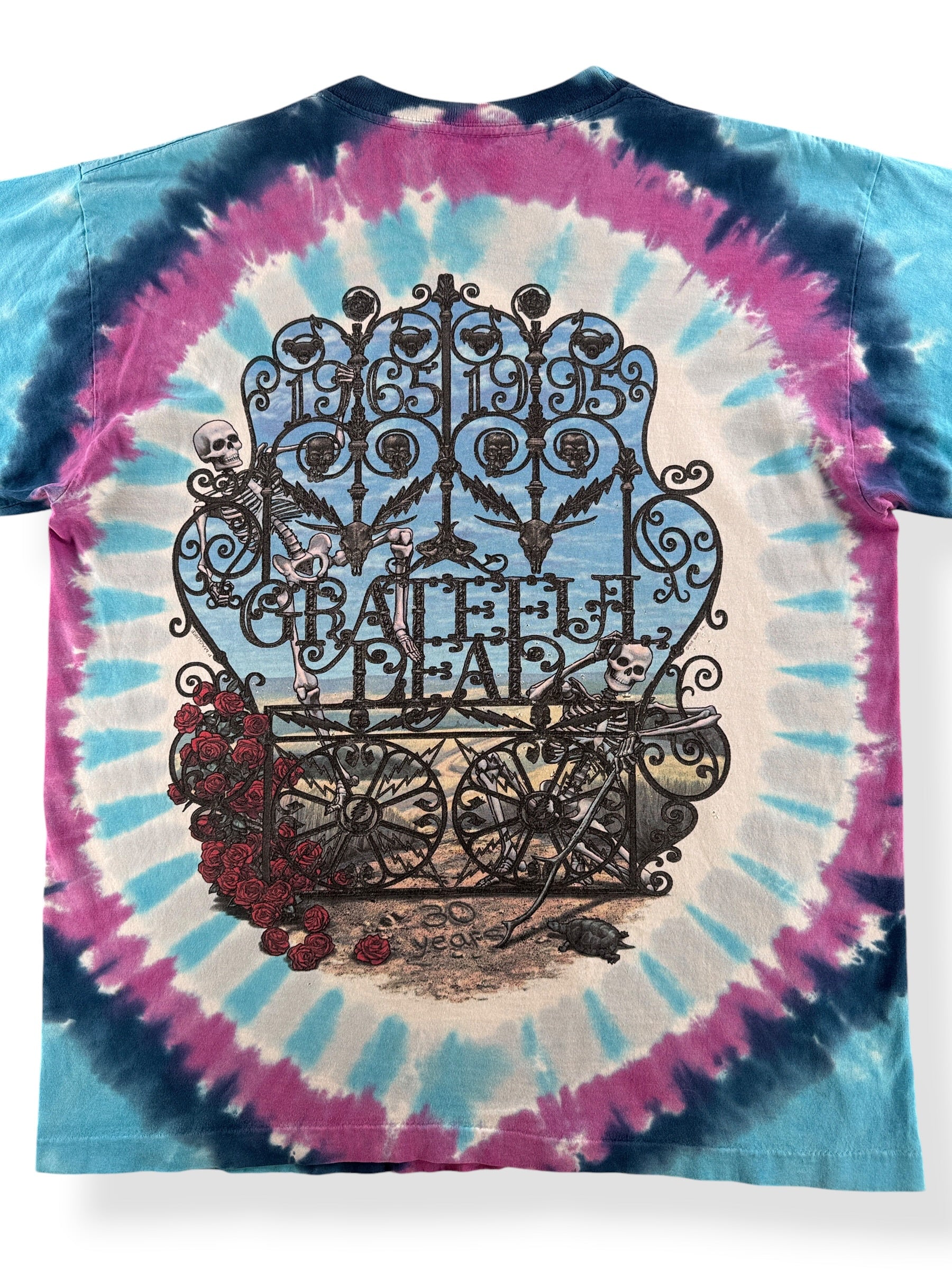 Close-up of the back of Vintage Liquid Blue Grateful Dead 30 Years Bertha Tee SZ L