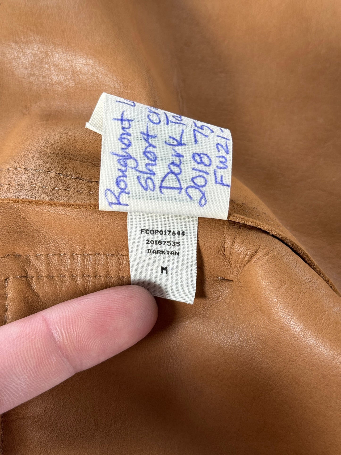 Size Tag on Filson Dark Tan Roughout Leather Short Cruiser SZ M