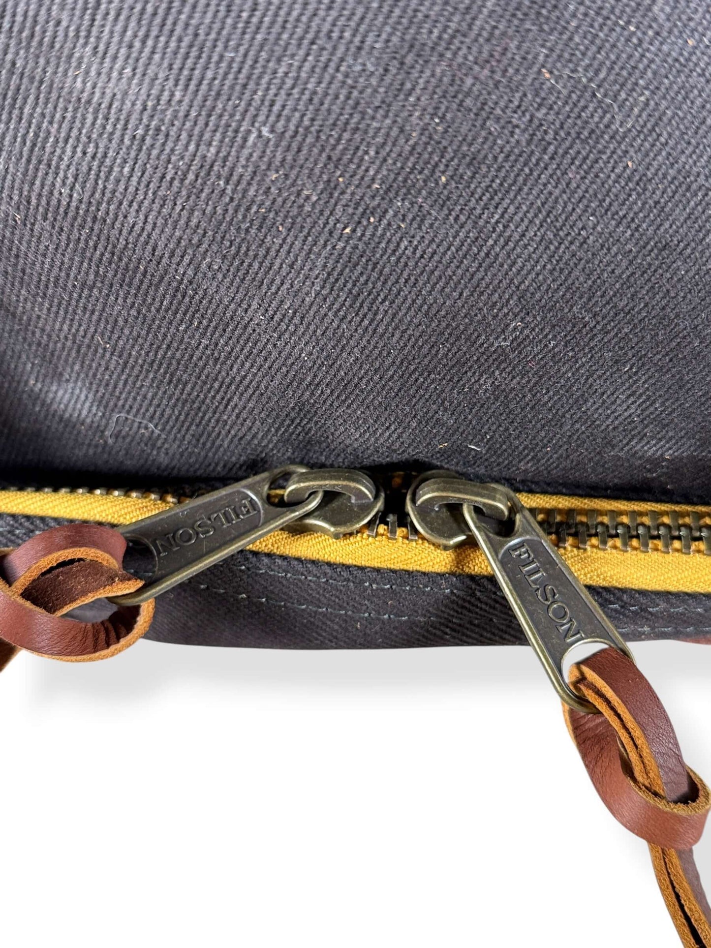 Bottom zippers on Filson x Chris Stapleton Traveller Outfitter Bag NWOT