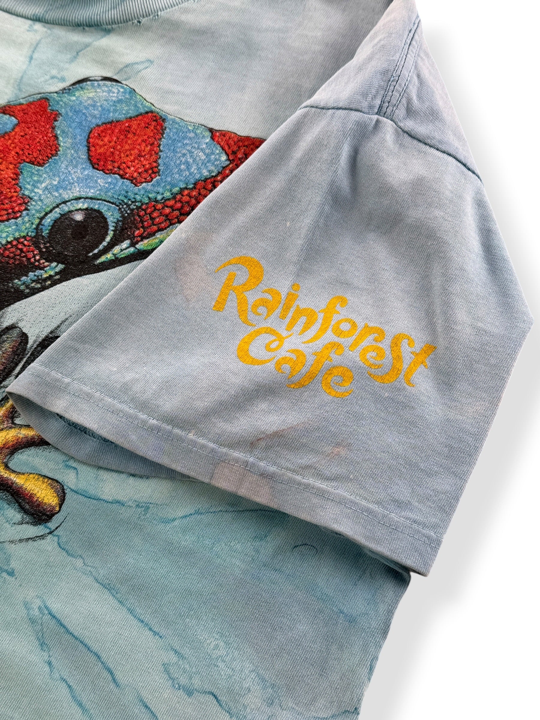 Sleeve graphic on Vintage AOP Rainforest Cafe Lizard Tee L - AS IS