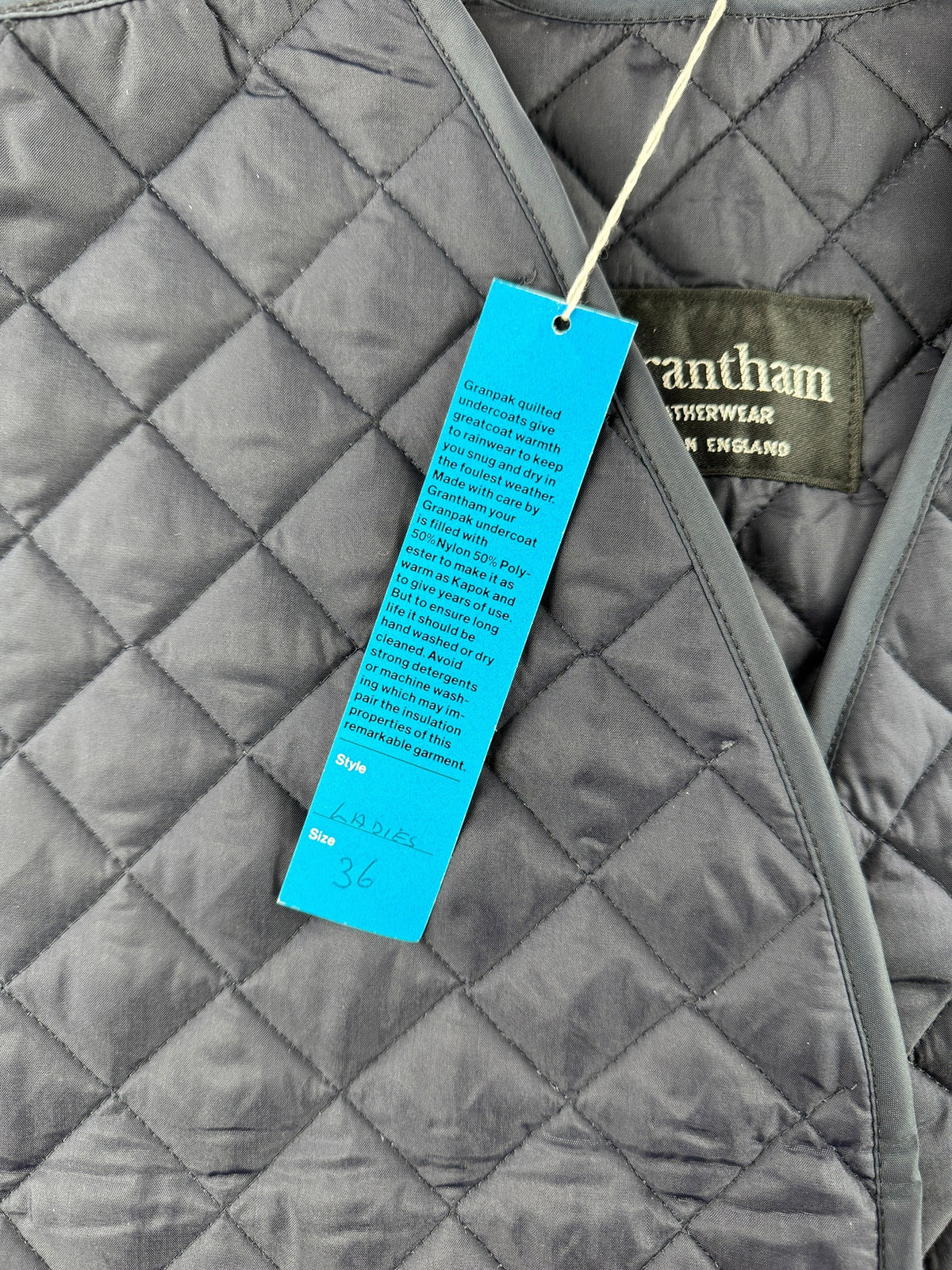 Back of hangtag on Vintage Grantham Long Quilted Vest SZ S