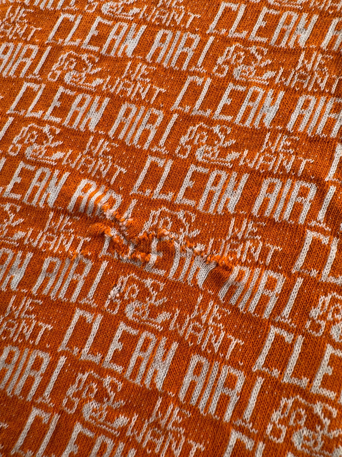 Repair on back of Vintage Rare 60s/70s We Want Clean Air Protest Tee SZ M