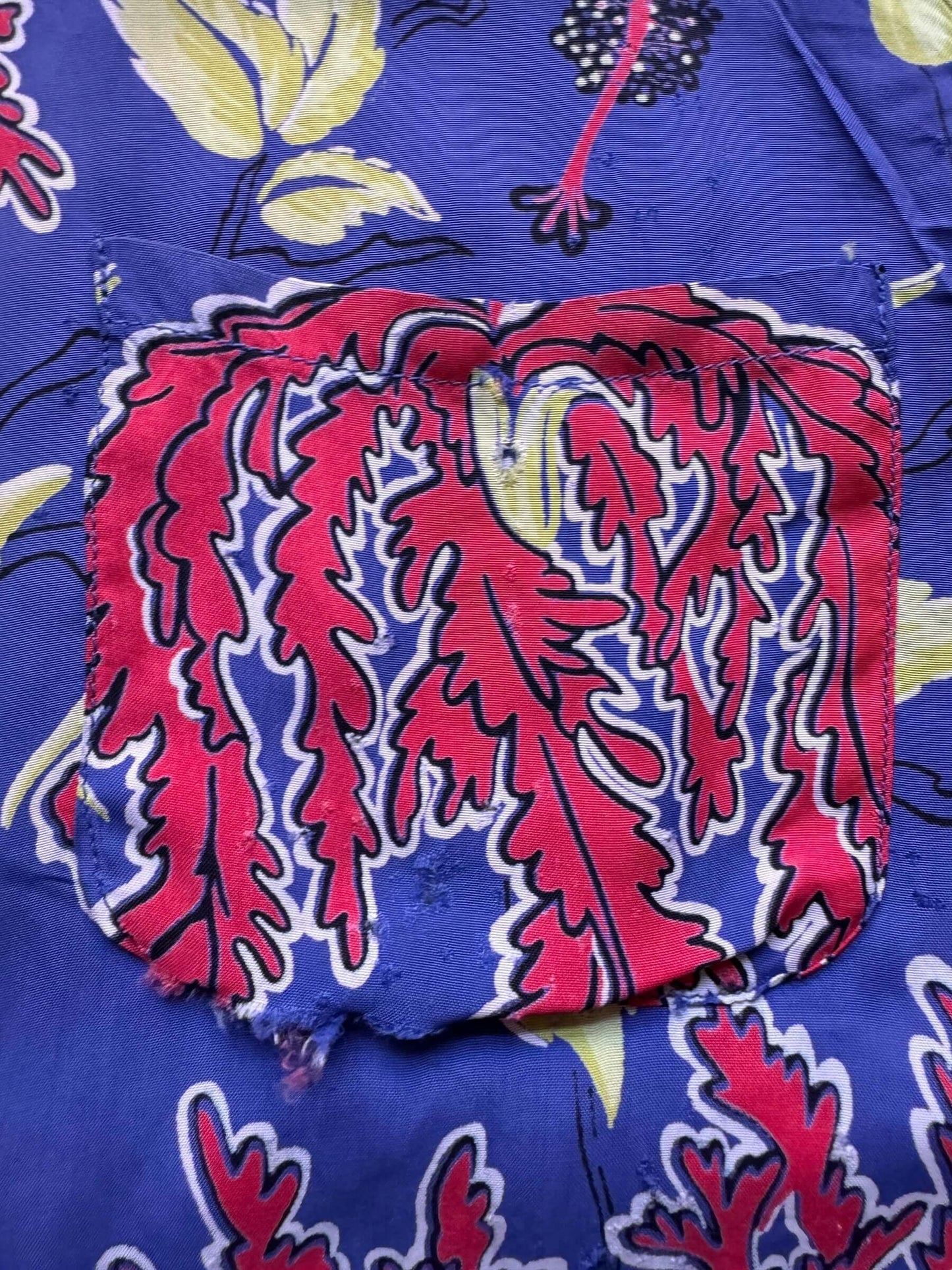 damage on left pocket of Vintage Made in California Rayon Aloha Shirt SZ M