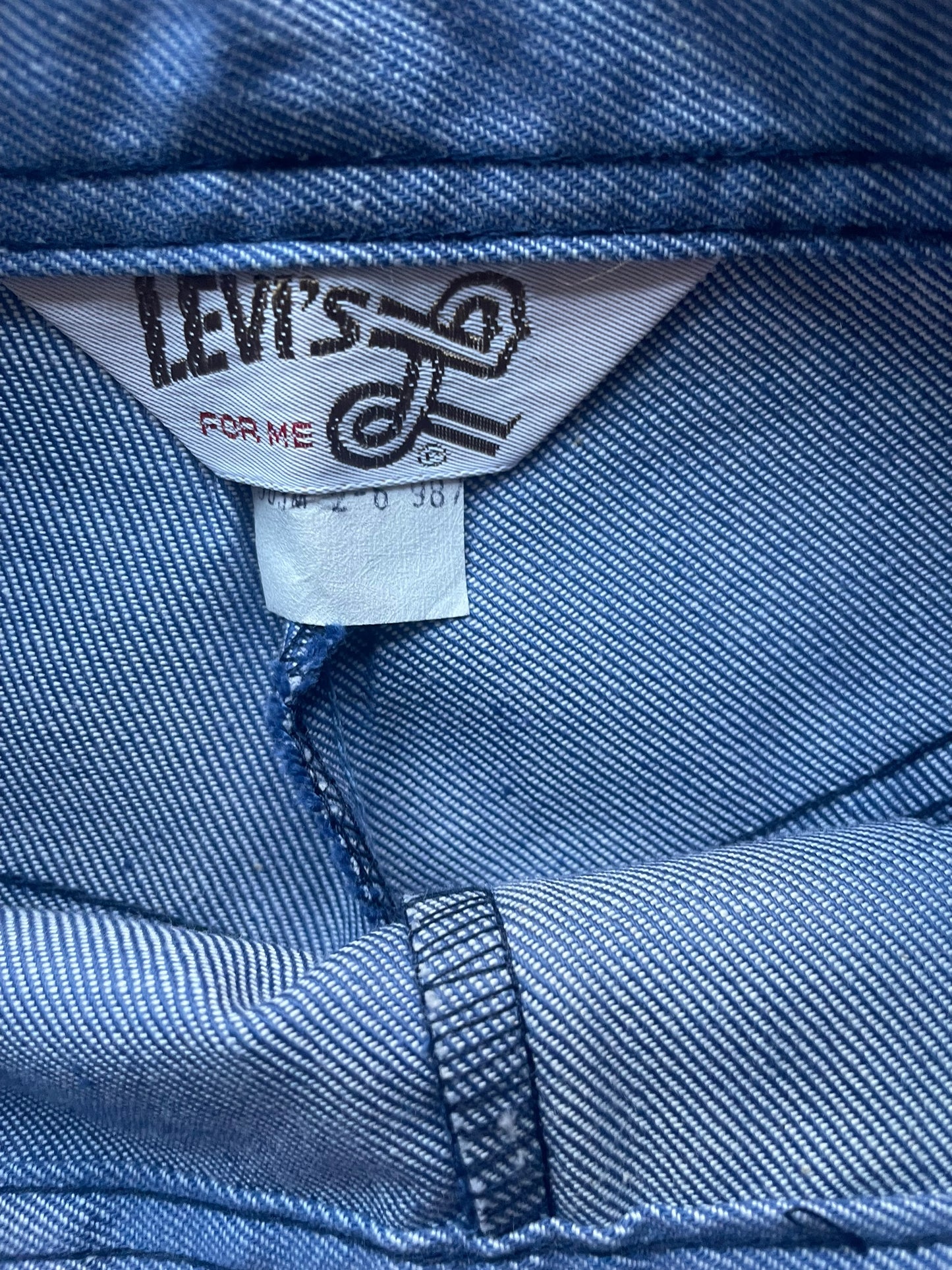 Tag view of Vintage 1970s Deadstock Levi's Wide Leg Trousers W25 | Barn Owl Vintage Seattle | Vintage Denim