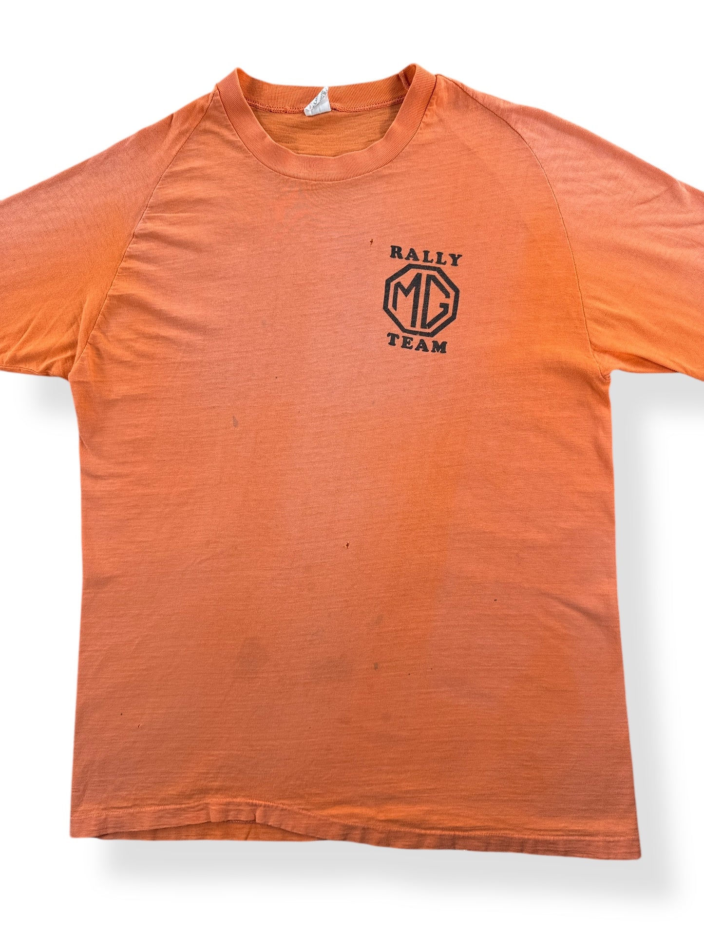 Front Close Up of Vintage Raglan Cut Creamsicle Orange MG Rally Team Springfoot Tee SZ M