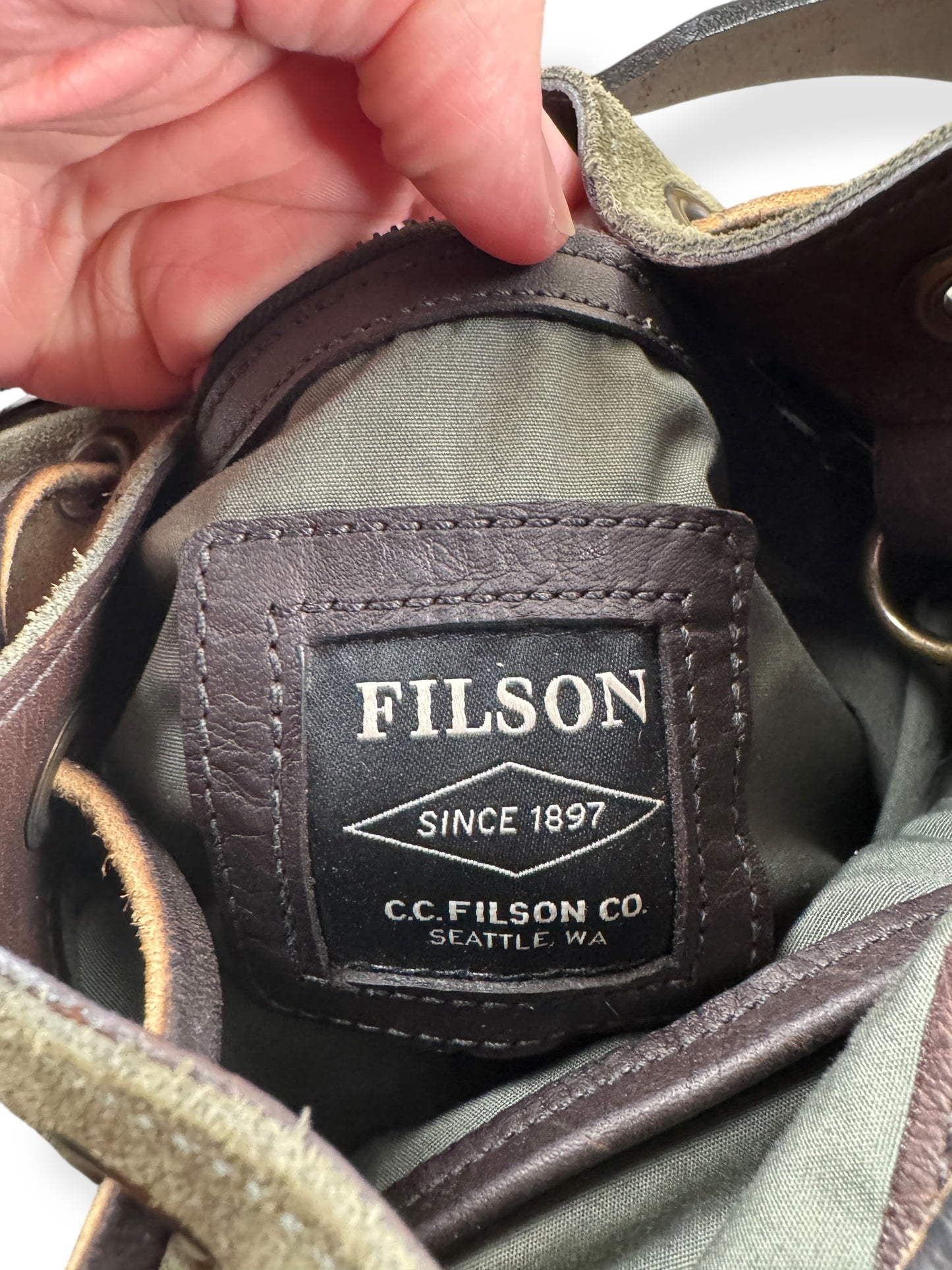 Label on Filson Green Suede Satchel Sample Bag