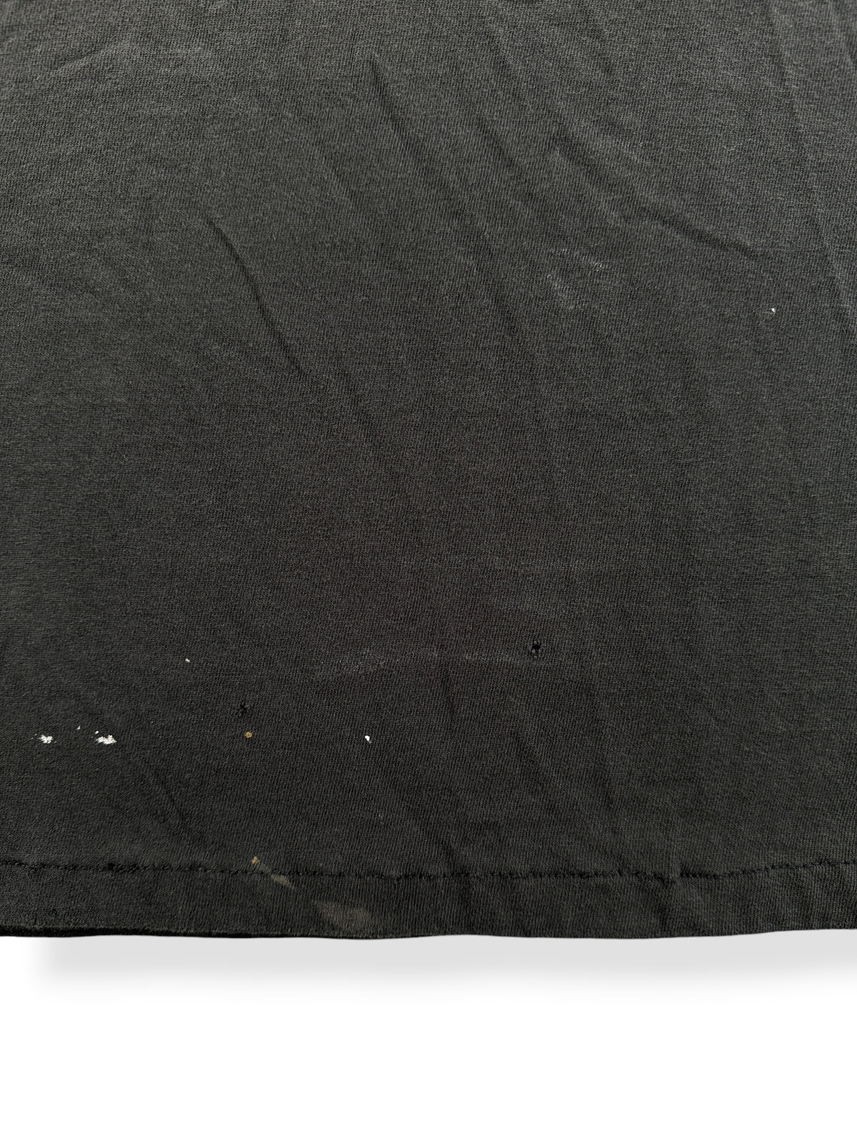 Paint splatter and small holes on front of Vintage Black Blank Pocket Tee SZ L