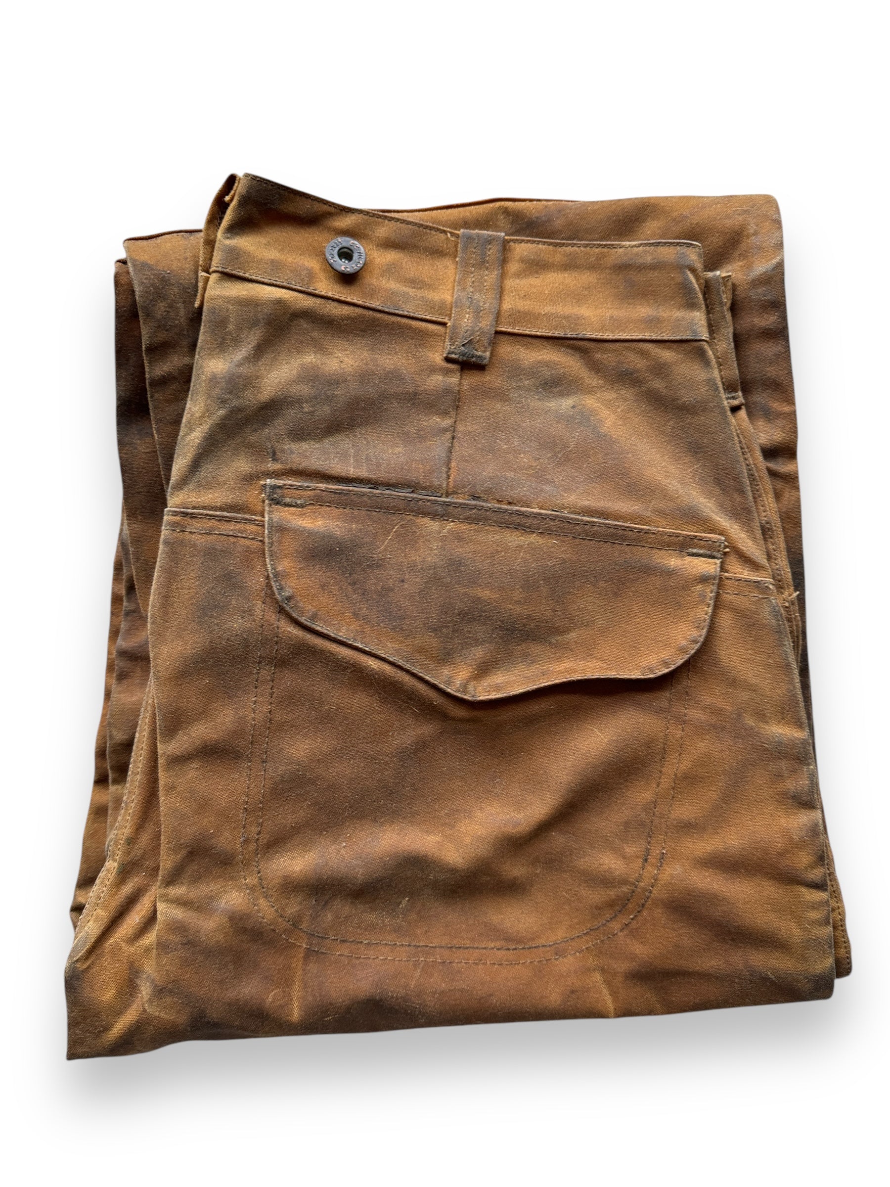 folded up Filson Style 67 Double Tin Oil Trousers W34x27