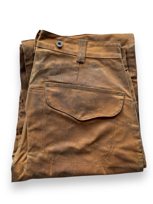 folded up Filson Style 67 Double Tin Oil Trousers W34x27