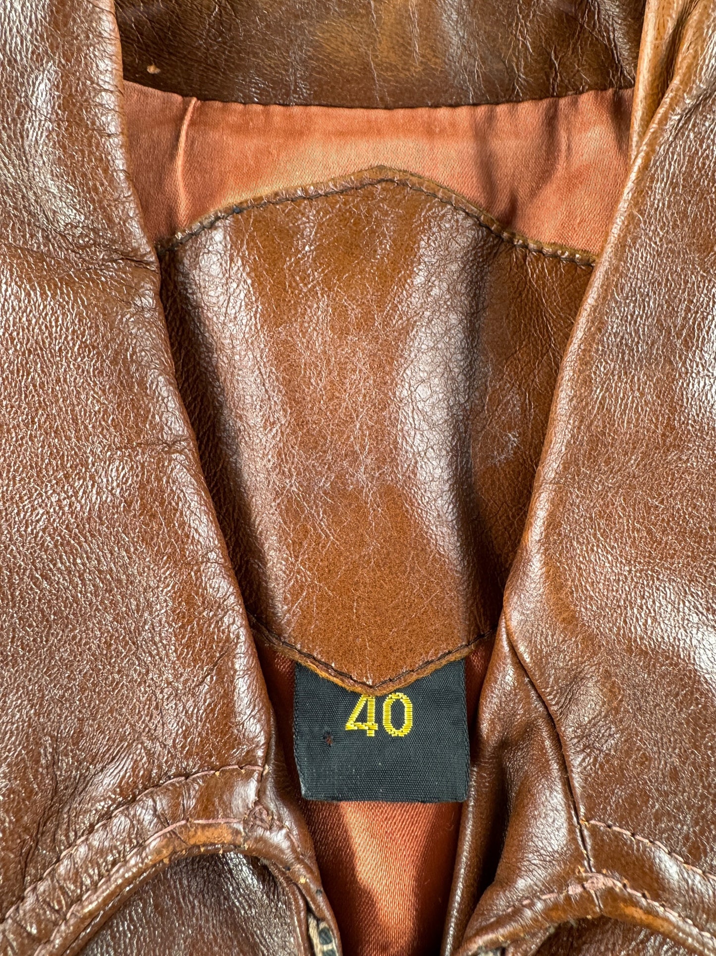 Size tag on Vintage 70s Brown Leather Jacket SZ 40
