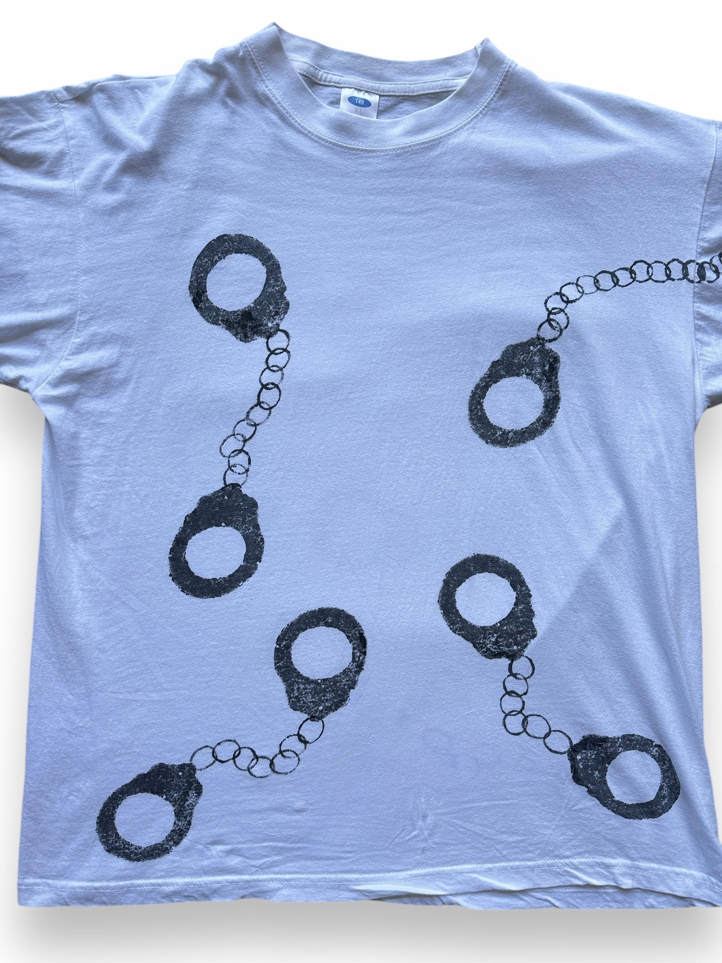 front close up of Vintage Handcuff AOP Tee SZ XL