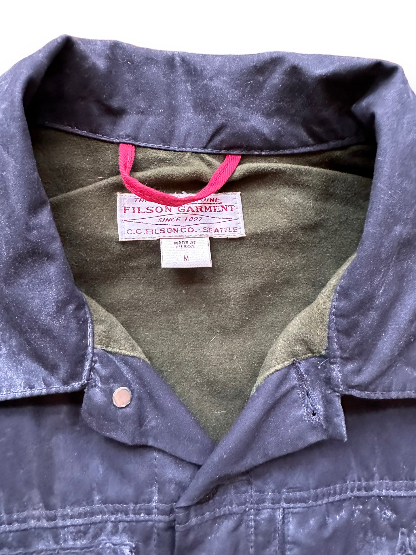 Sizing Tag on Filson Black Short Lined Tin Cloth Cruiser SZ M |  Barn Owl Vintage Goods | Vintage Filson Workwear Seattle