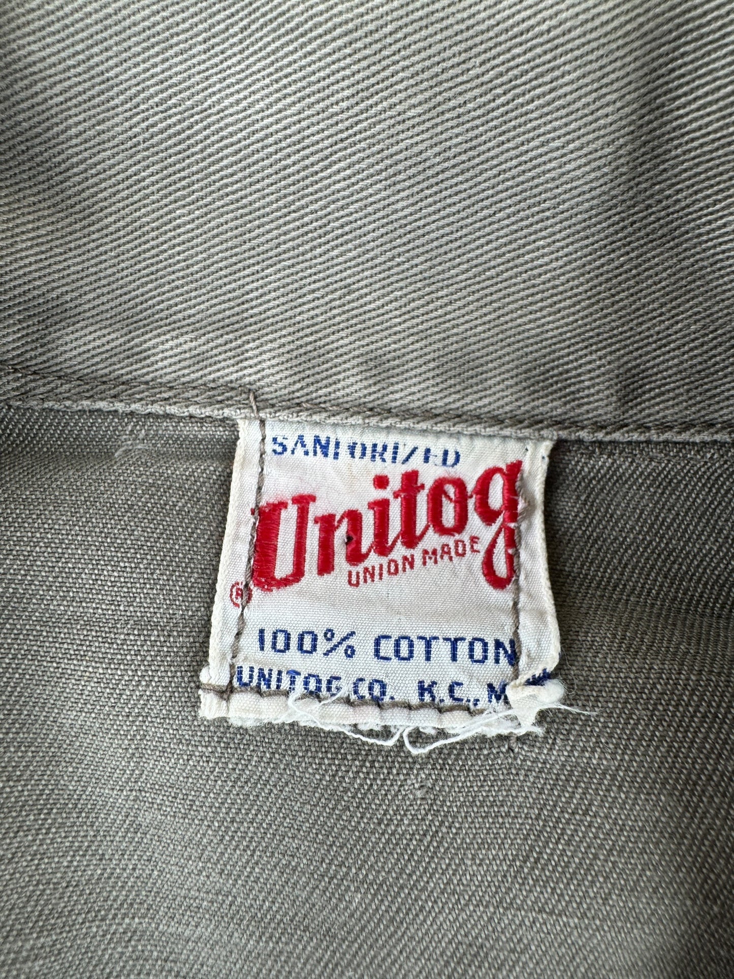 Tag on Vintage Unitog Grey Repaired Shop Coat SZ M