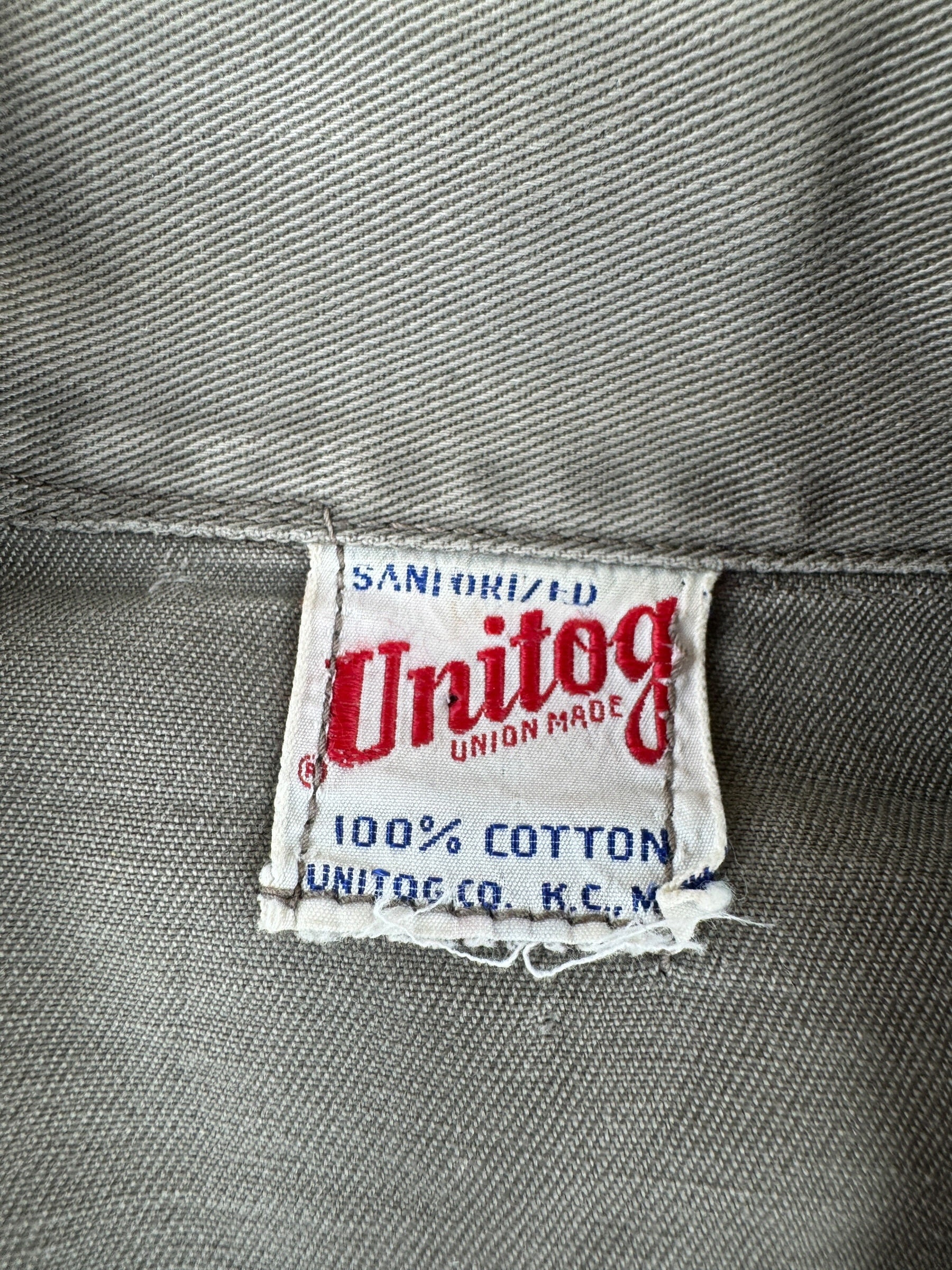 Tag on Vintage Unitog Grey Repaired Shop Coat SZ M