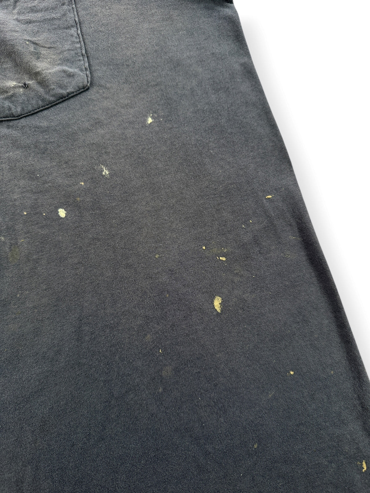 Paint on front of Vintage Distressed Navy Blue Pocket Tee SZ L