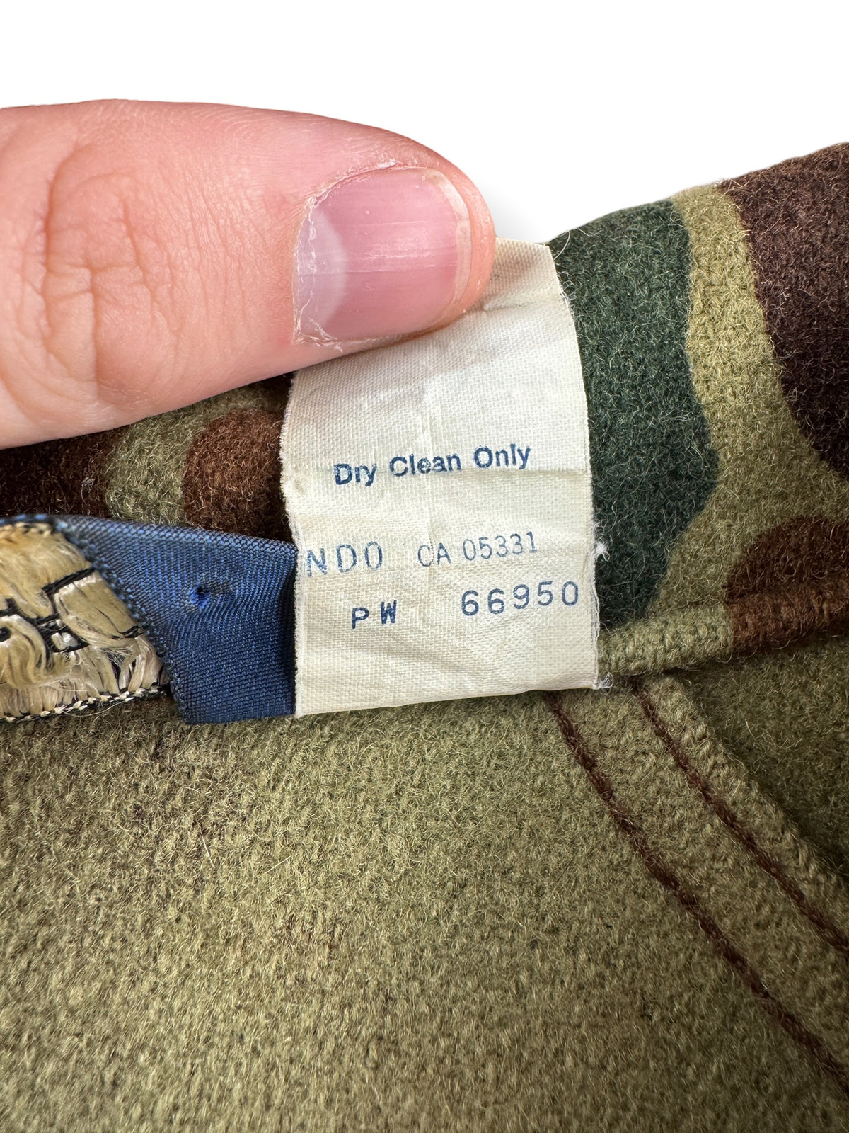 Back of tags on Vintage Woolrich Duck Camo Bomber Jacket SZ M