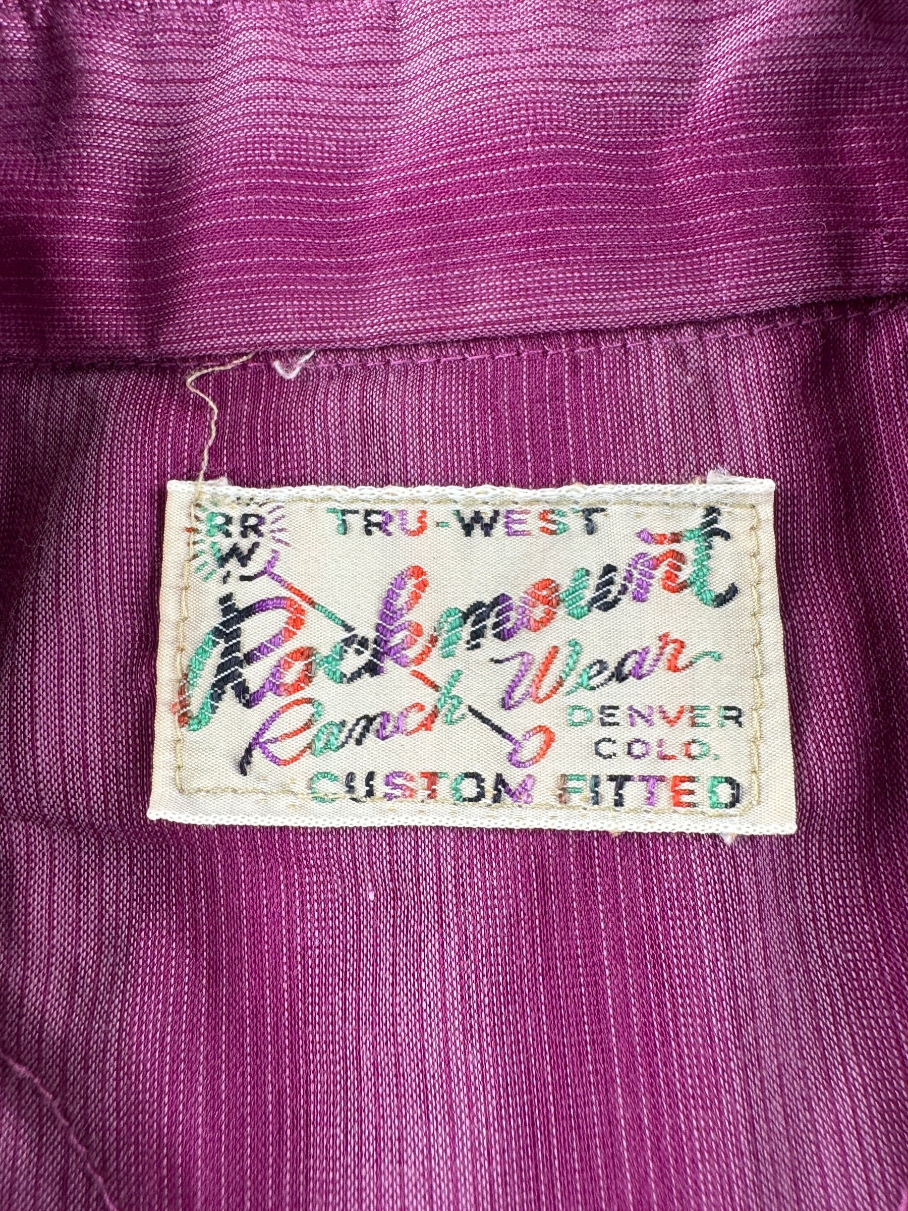 Label on Vintage Rockmount Ranch Wear Purple Pearlsnap SZ M