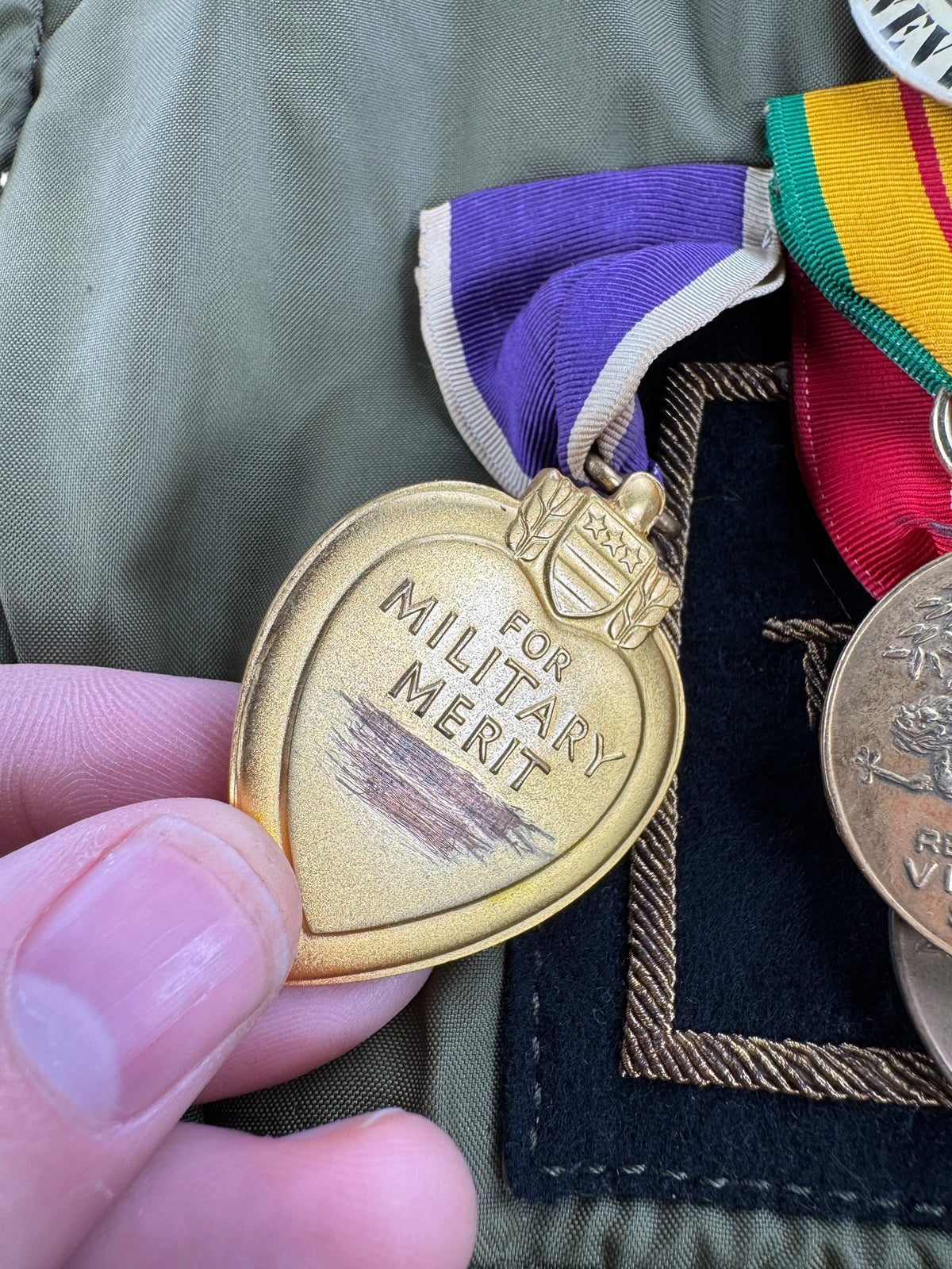 Back of purple heart medal on Vintage Vietnam Winter Flyers Jacket w/ Patches SZ 46