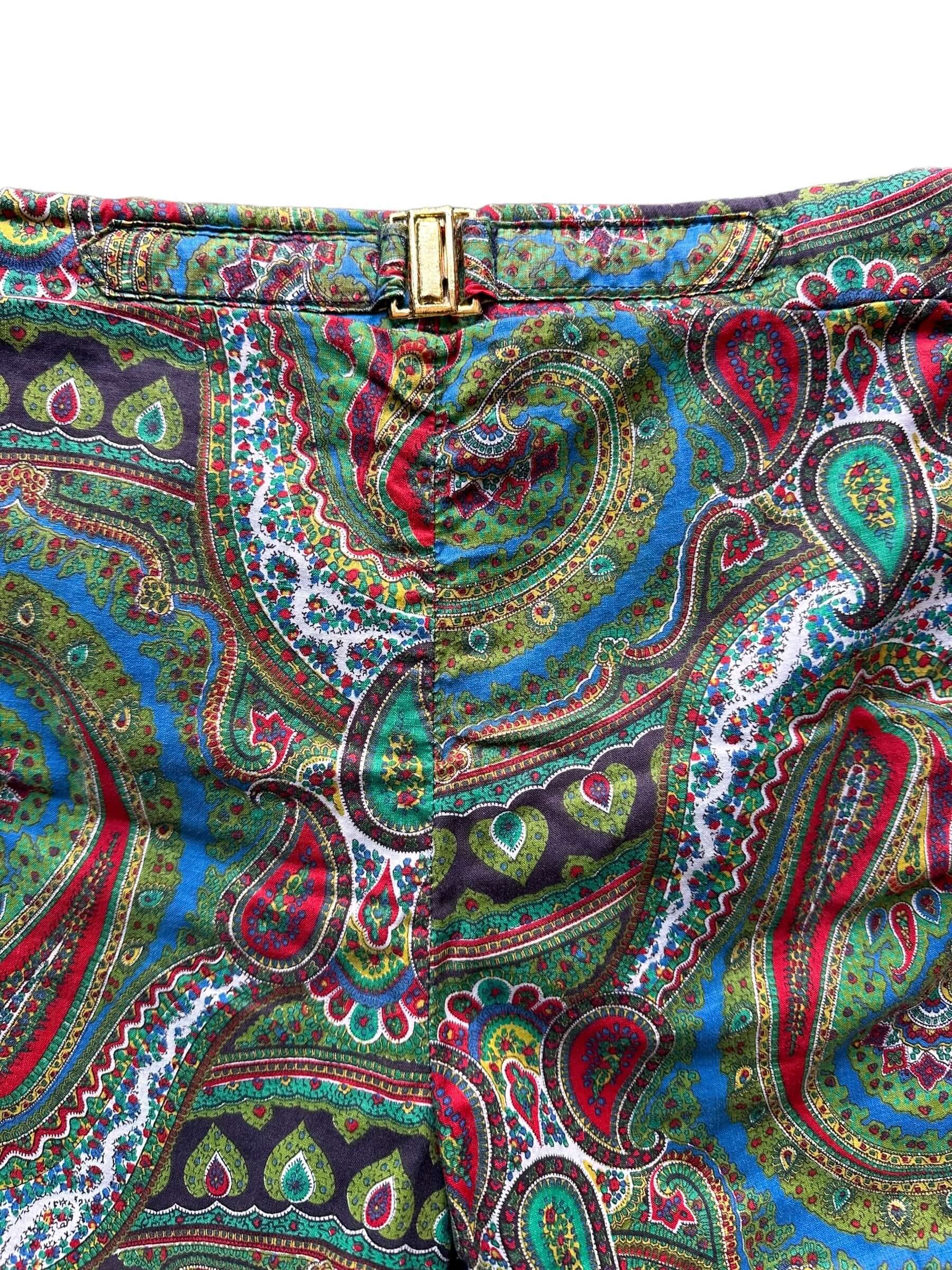 front buckle of Vintage McGregor "Swim-n-Play" Paisley Swim Trunks SZ 34 | Barn Owl Vintage Seattle | Vintage Swim Trunks Seattle