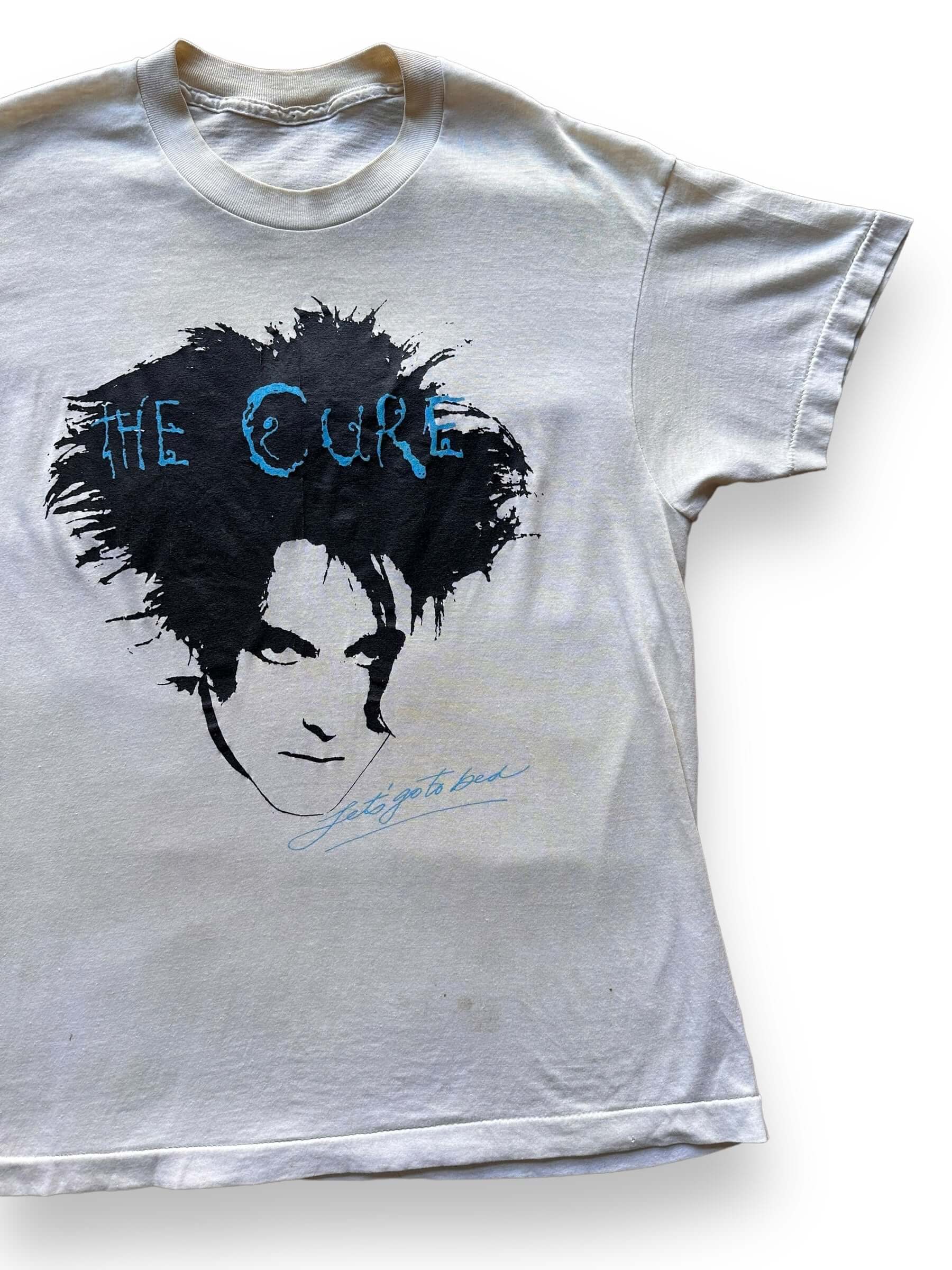 front left of Vintage 80s The Cure "Let's Go to Bed" Band Tee Shirt SZ M