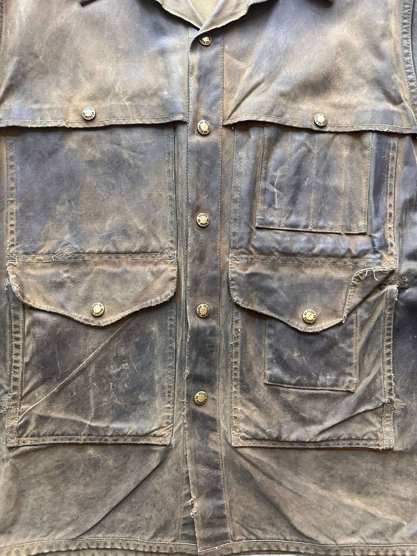 Front Close Up of Distressed & Repaired Filson Tin Cloth Cruiser Size XL