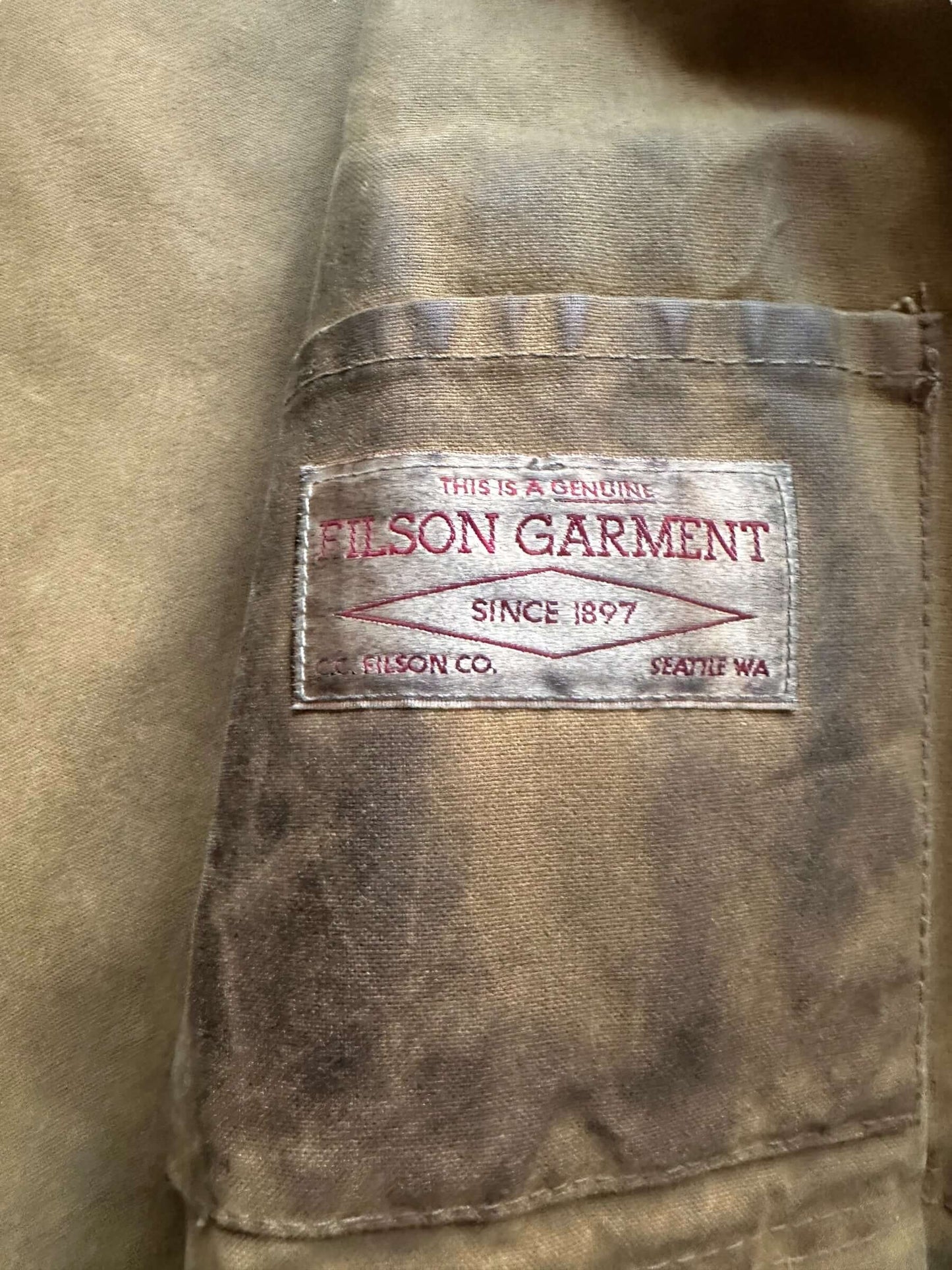 Filson Tag View of Distressed & Repaired Filson Tin Cloth Cruiser Size XL