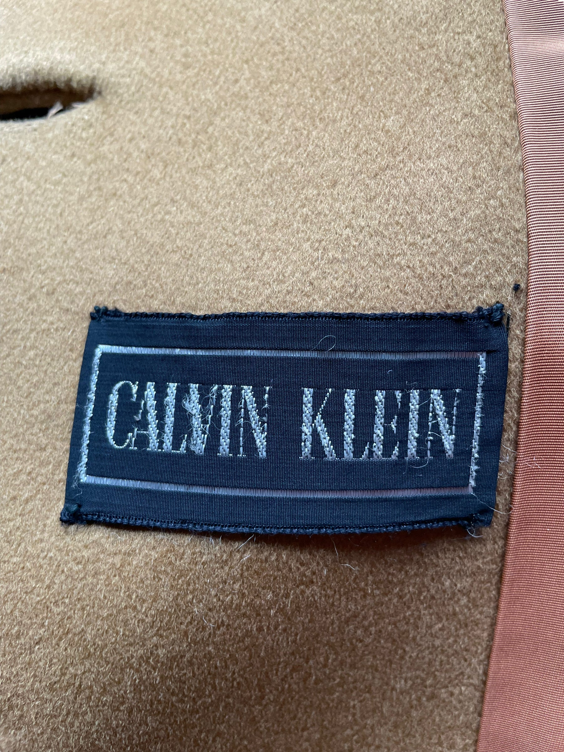 Calvin Klein tag view of Vintage 1960s Calvin Klein Mod Camel Coat SZ S-M | Seattle True Vintage | Barn Owl Vintage Coats