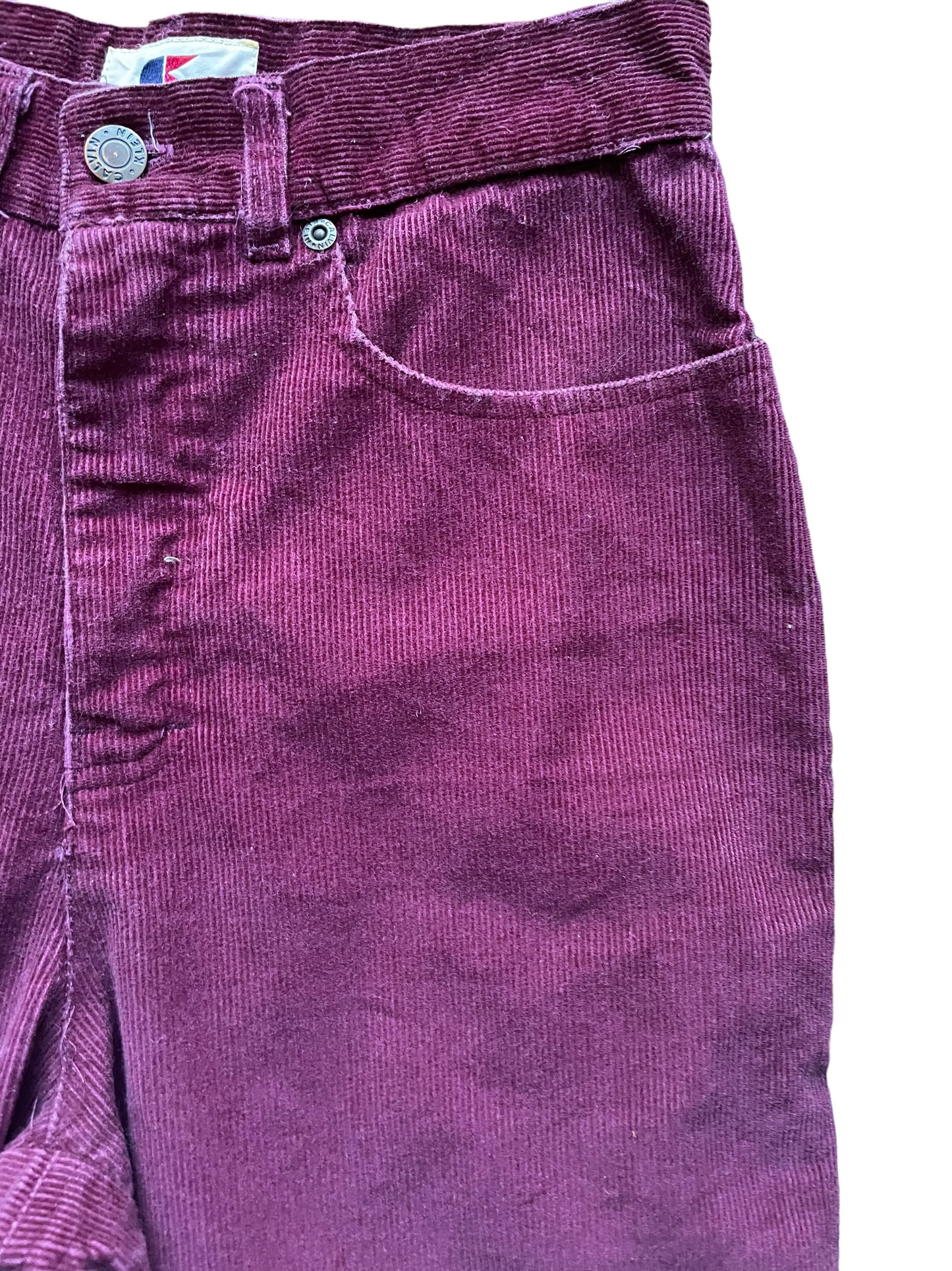 Front left side waist view of Vintage 1970s Calvin Klein Corduroy Pants W26 | Barn Owl Vintage Seattle | Vintage Corduroy Pants