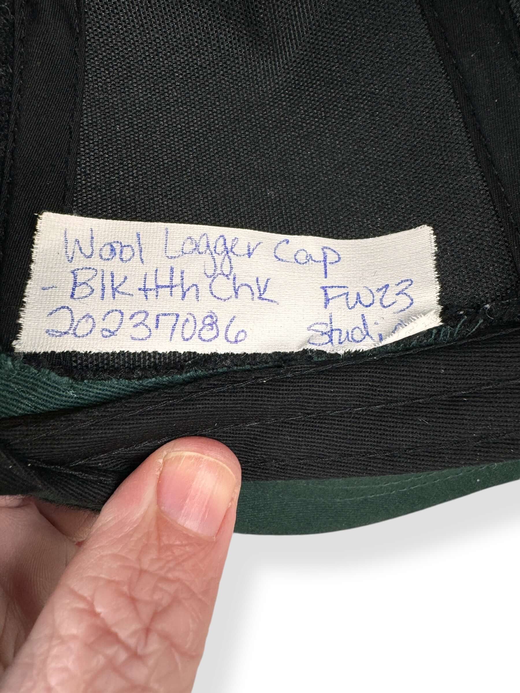 Tag View of Filson Black Heather Check Wool Logger Cap