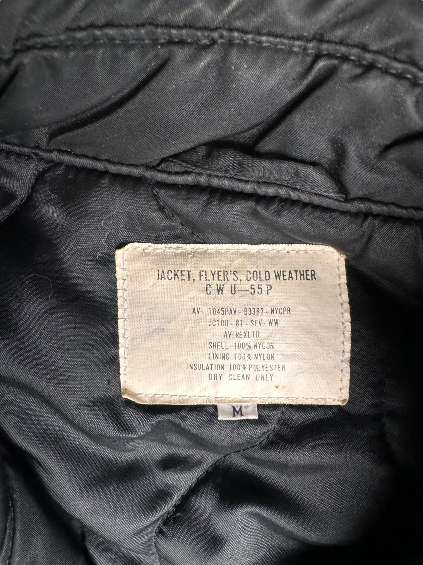 Tag Close Up of Vintage CWU 55 Cold Weather Flyers Jacket SZ M