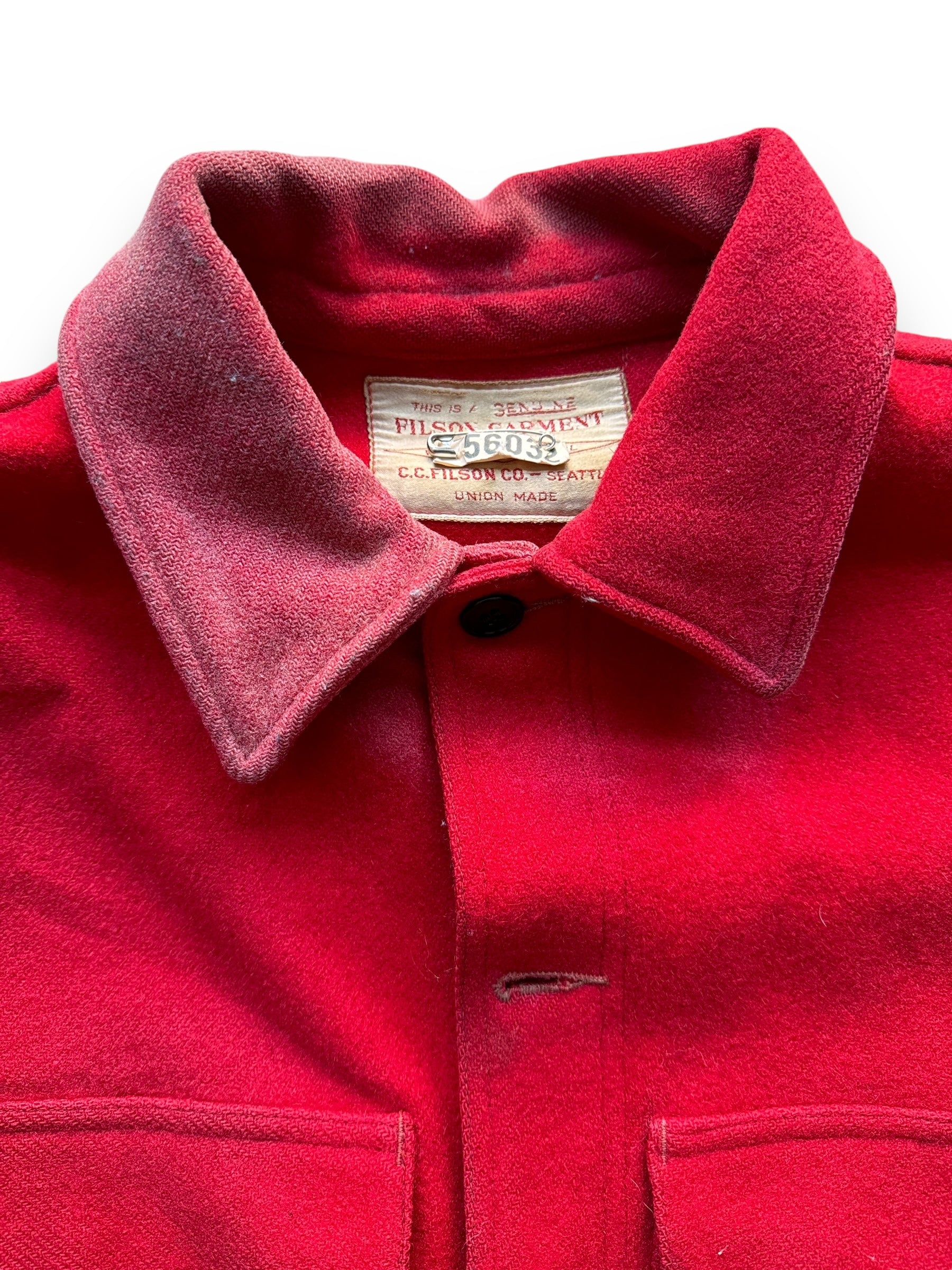 Sun Faded Collar and Tag View of Vintage Sun Faded Union Made Filson Scarlet Cruiser SZ L