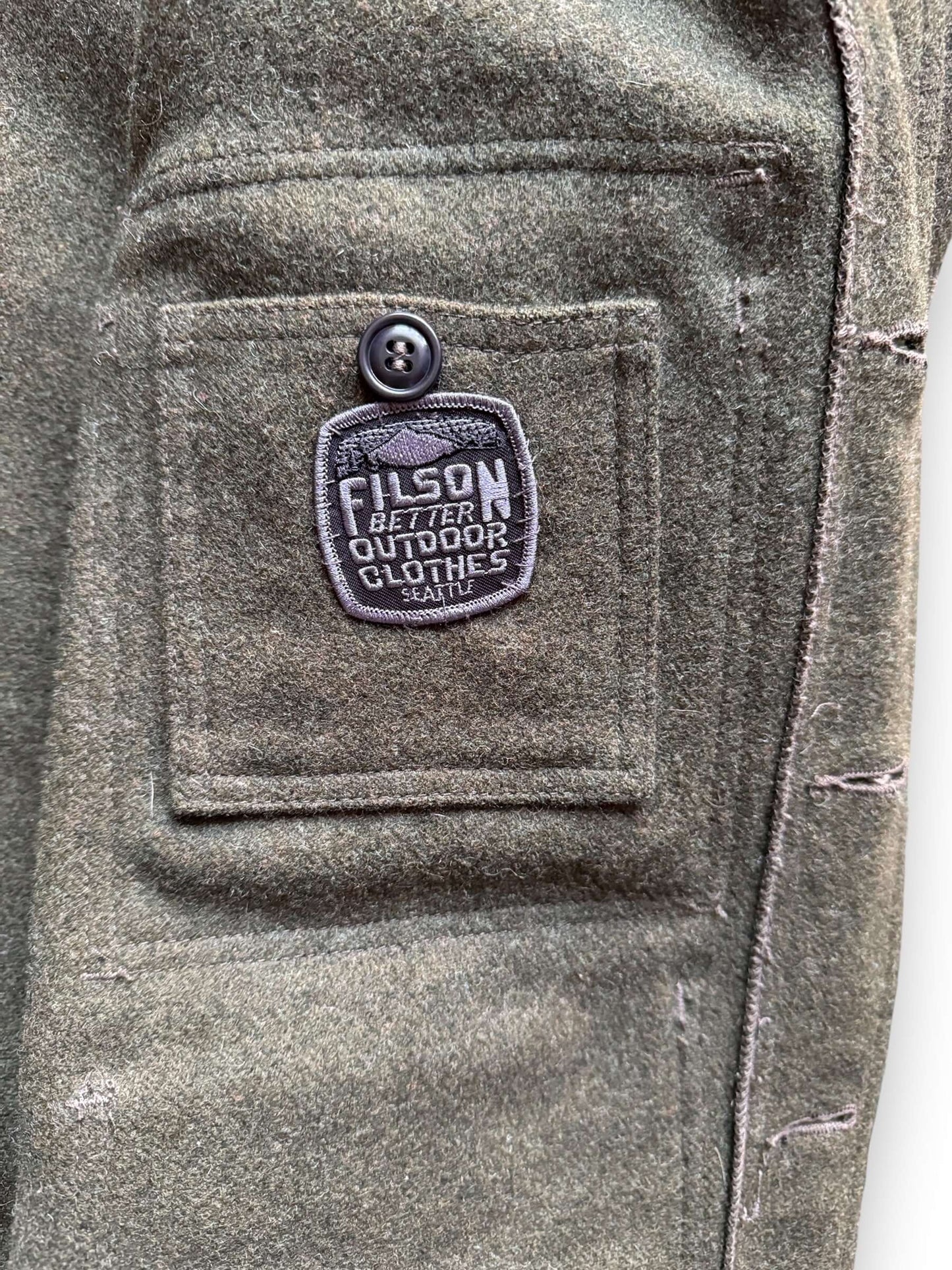 Patch on Inside Pocket on Filson Forest Green Mackinaw Cruiser SZ L