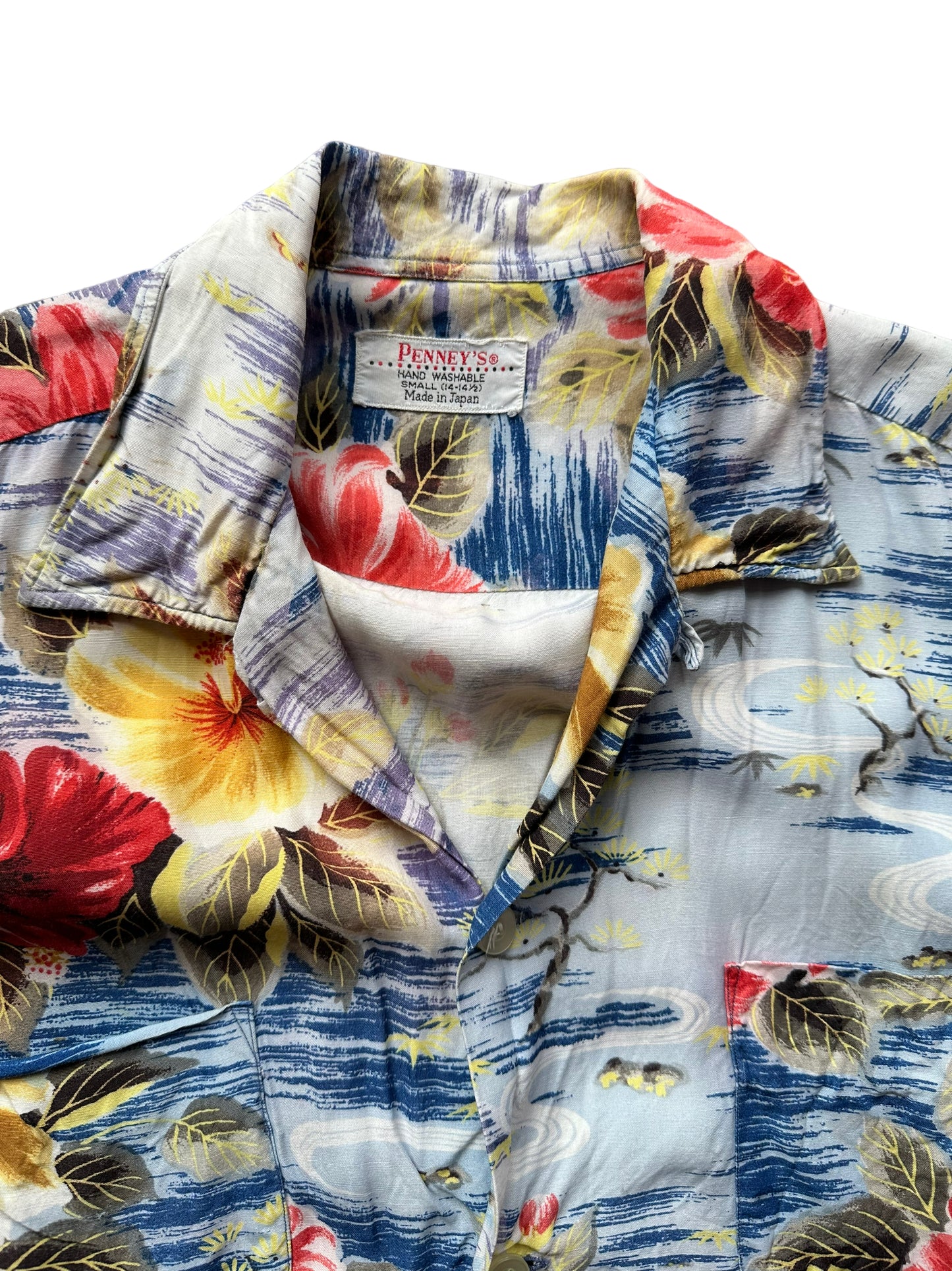 Tag shot of Vintage Made in Japan Penney's Blue/Red/Yellow Floral Aloha Shirt SZ S | Seattle Vintage Rayon Hawaiian Shirt | Barn Owl Vintage Clothing Seattle