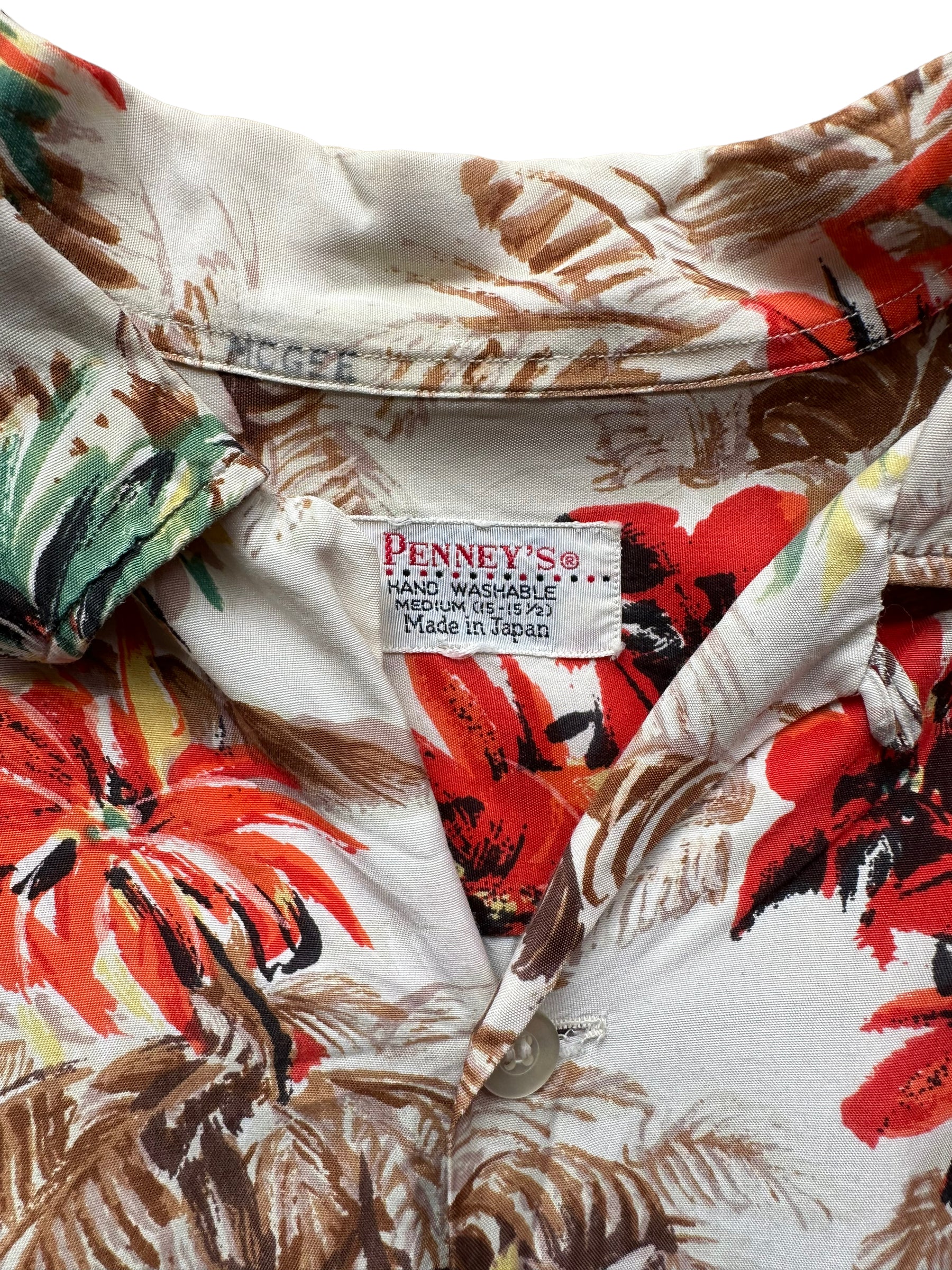 Tag close up of Vintage Made in Japan Penney's Brown/Orange Floral Aloha Shirt SZ M | Seattle Vintage Rayon Hawaiian Shirt | Barn Owl Vintage Clothing Seattle