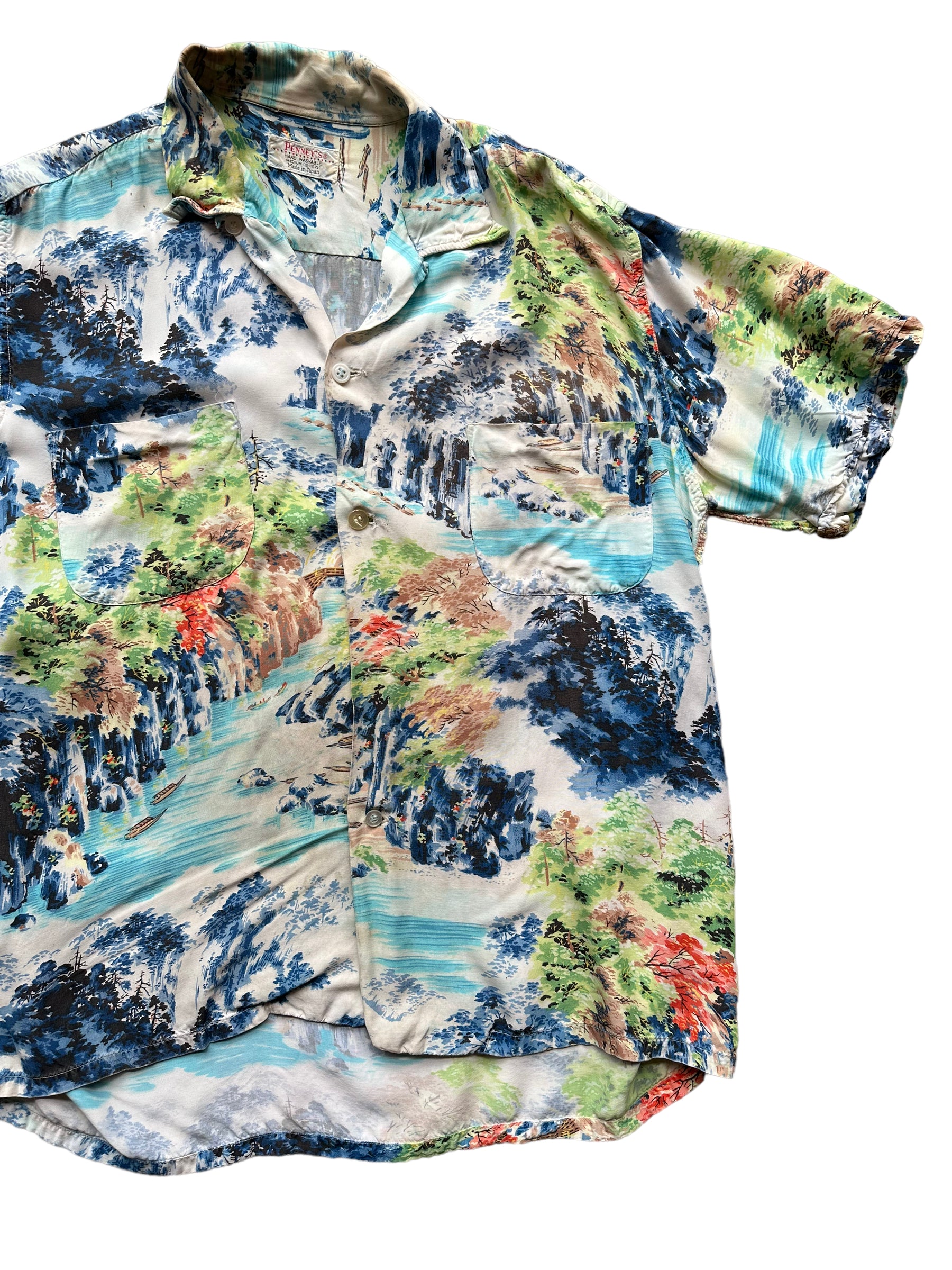 Front left shot of Vintage Made in Japan Penney's Navy/Blue/Green Landscape Aloha Shirt SZ M | Seattle Vintage Rayon Hawaiian Shirt | Barn Owl Vintage Clothing Seattle