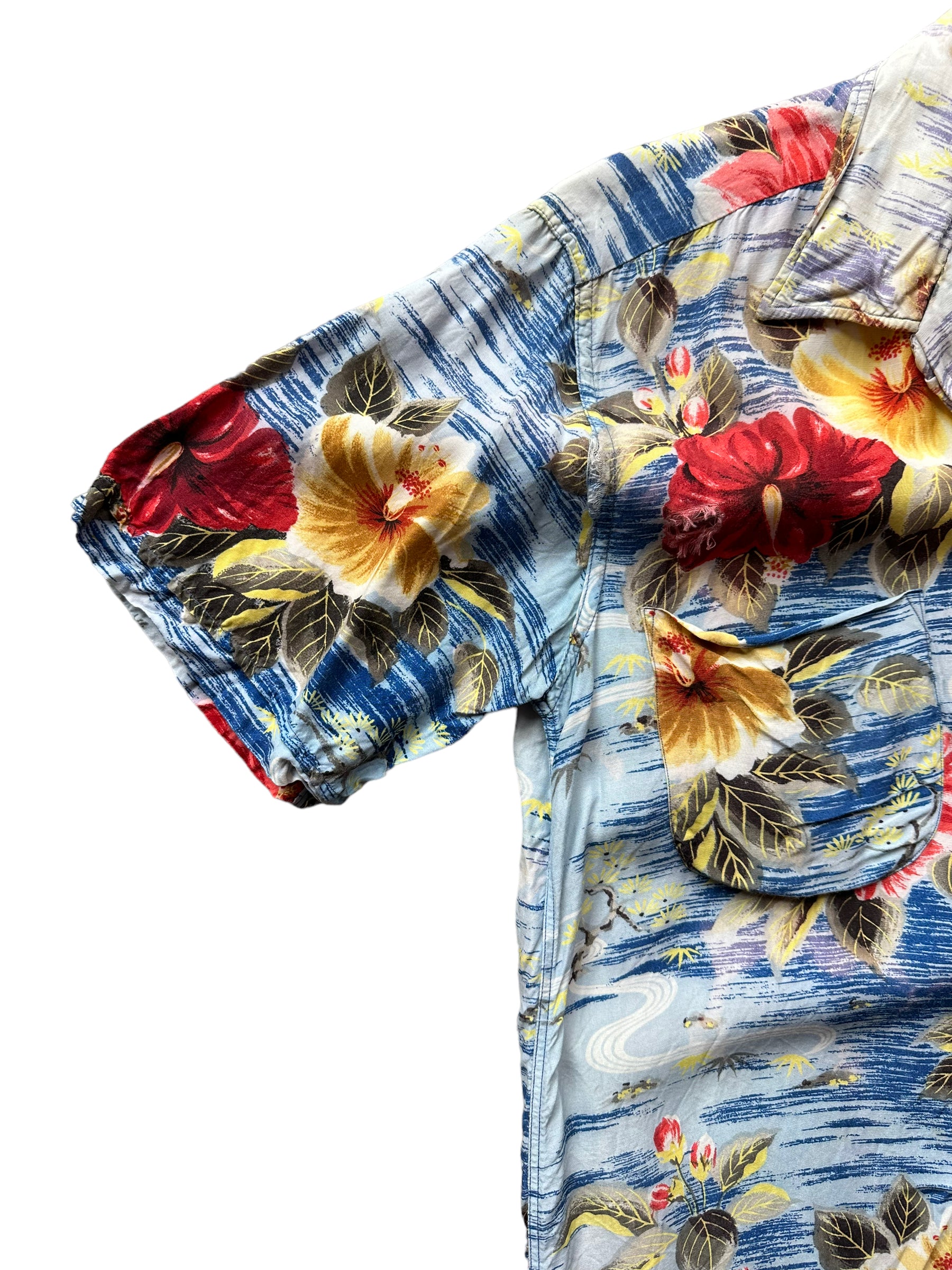 Right sleeve of Vintage Made in Japan Penney's Blue/Red/Yellow Floral Aloha Shirt SZ S | Seattle Vintage Rayon Hawaiian Shirt | Barn Owl Vintage Clothing Seattle