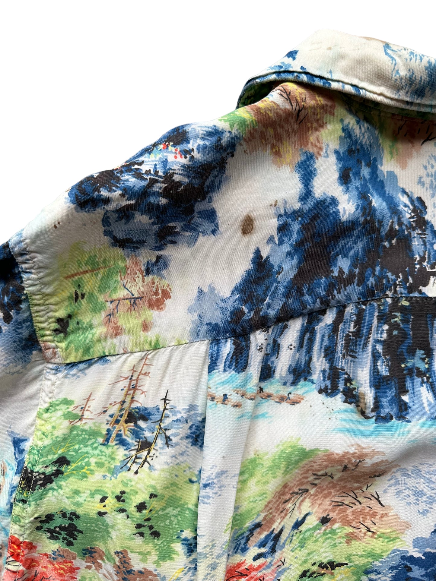Stain on back left shoulder on Vintage Made in Japan Penney's Navy/Blue/Green Landscape Aloha Shirt SZ M | Seattle Vintage Rayon Hawaiian Shirt | Barn Owl Vintage Clothing Seattle