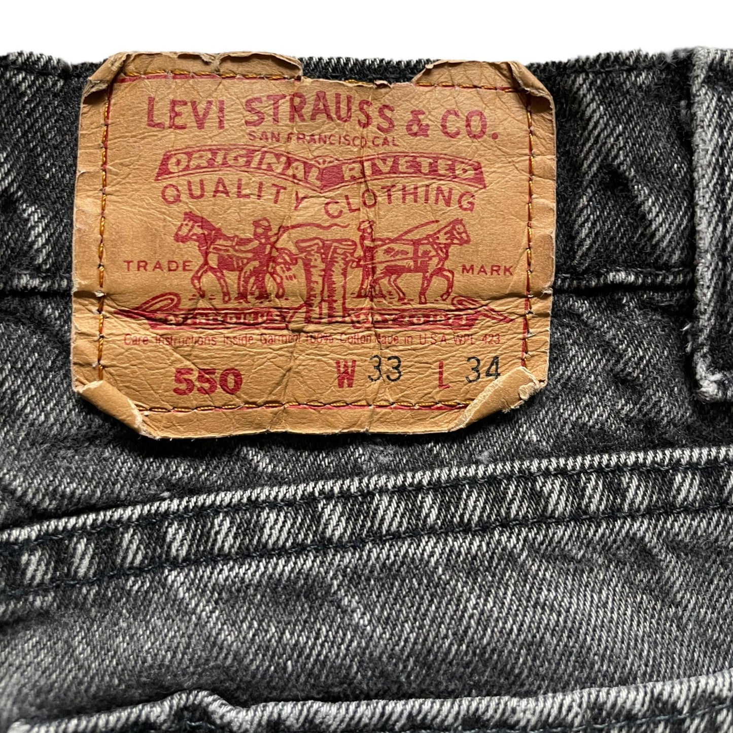 Back tag view of Vintage USA Mended Black Levi's 550s 33x34 