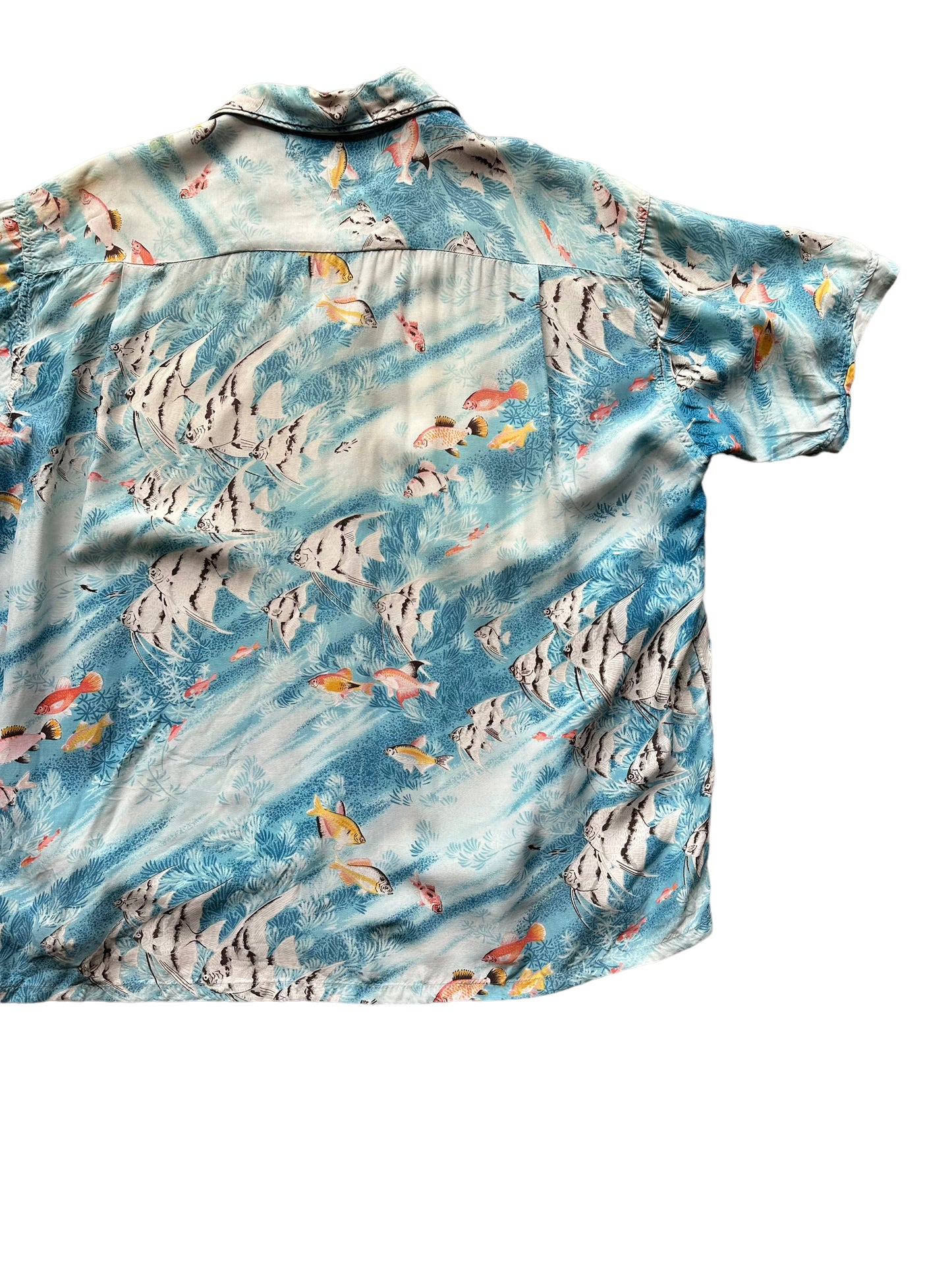 Back right shot of Vintage Penny's Blue Tropical Fish Aloha Shirt SZ XL | Seattle Vintage Rayon Hawaiian Shirt | Barn Owl Vintage Clothing Seattle