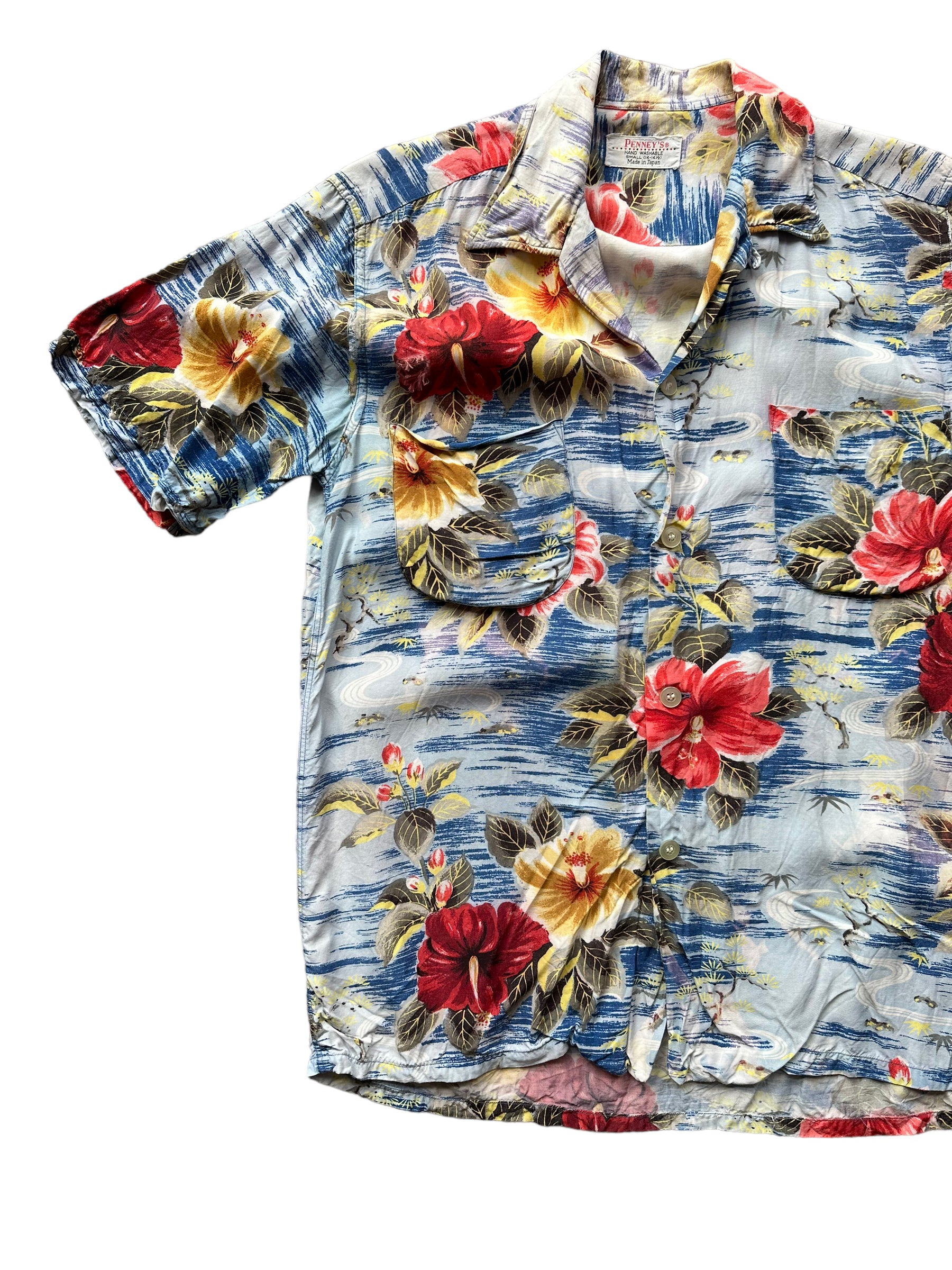 Front right of Vintage Made in Japan Penney's Blue/Red/Yellow Floral Aloha Shirt SZ S | Seattle Vintage Rayon Hawaiian Shirt | Barn Owl Vintage Clothing Seattle