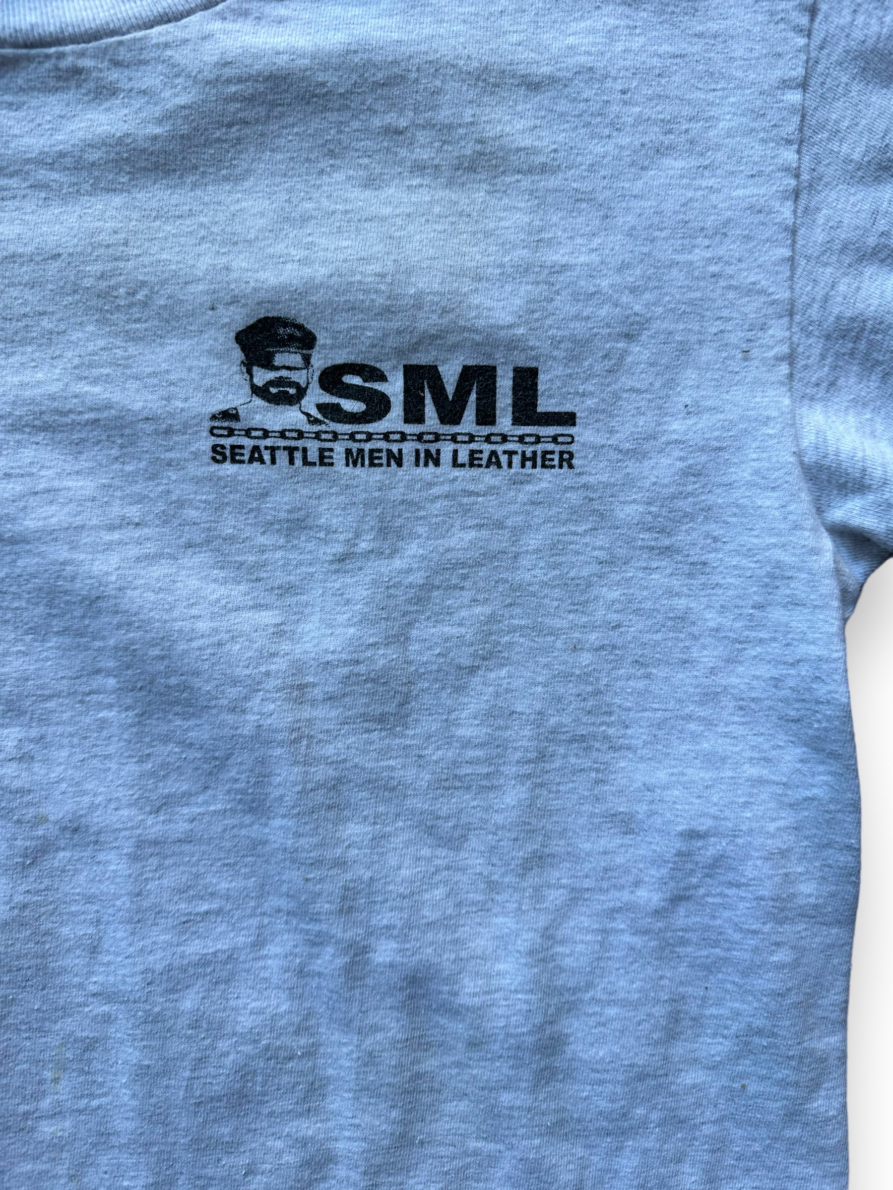 Graphic close up of Vintage Seattle Men in Leather Tee SZ S | Vintage T-Shirts Seattle | Barn Owl Vintage Tees Seattle
