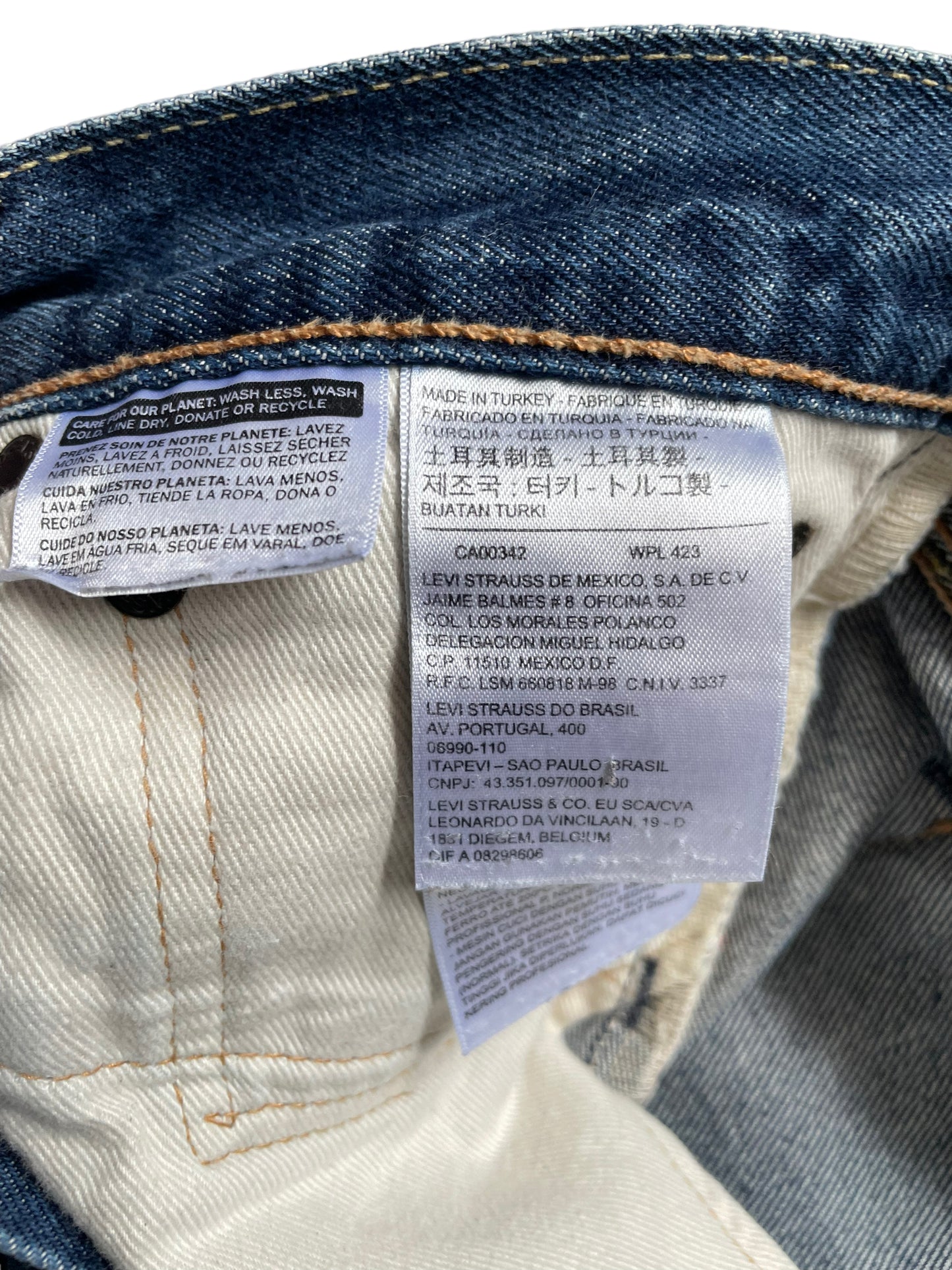 Inside tags of Levi's 511 Selvedge Denim 32x36