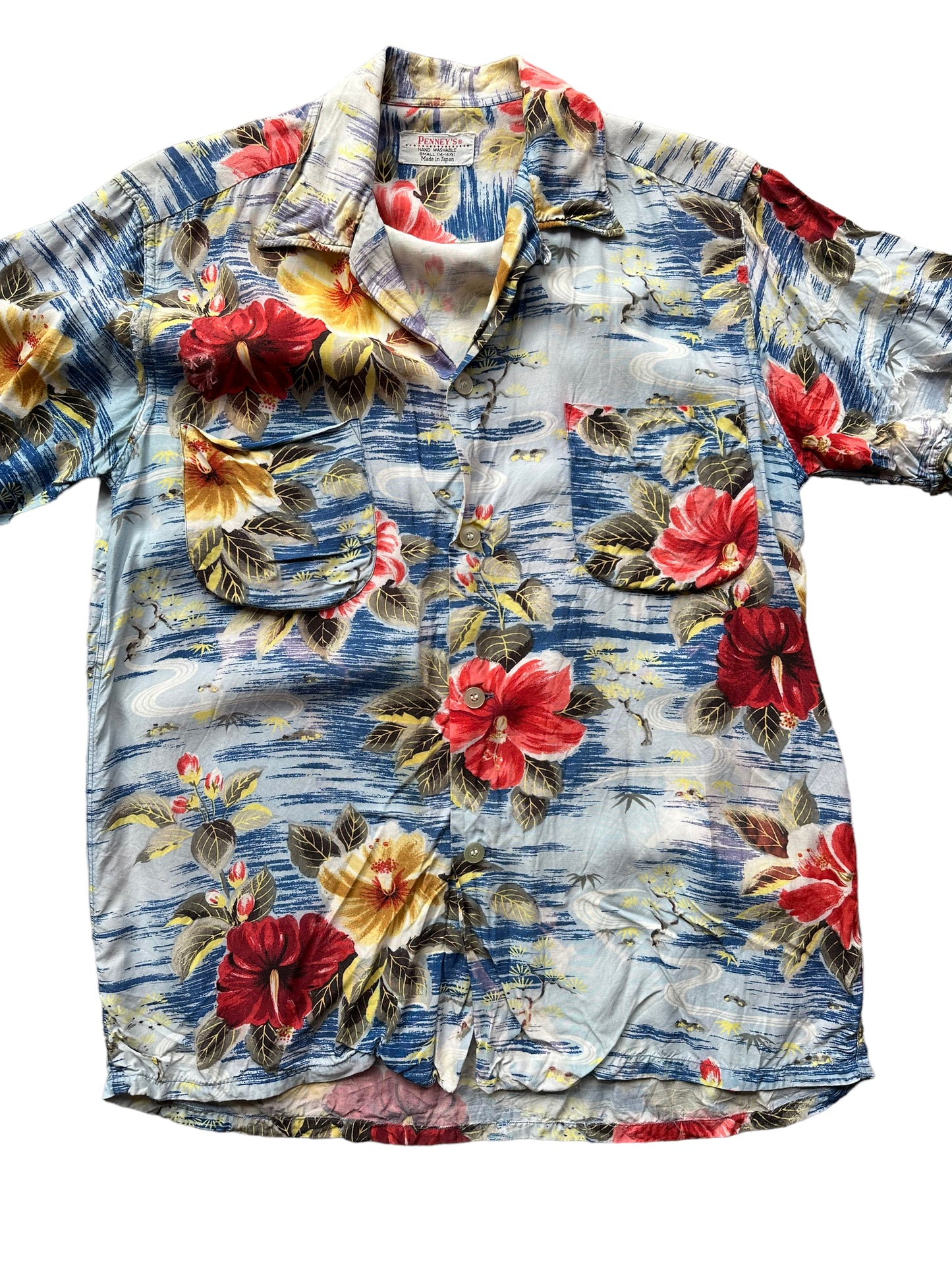 Front close up of Vintage Made in Japan Penney's Blue/Red/Yellow Floral Aloha Shirt SZ S | Seattle Vintage Rayon Hawaiian Shirt | Barn Owl Vintage Clothing Seattle