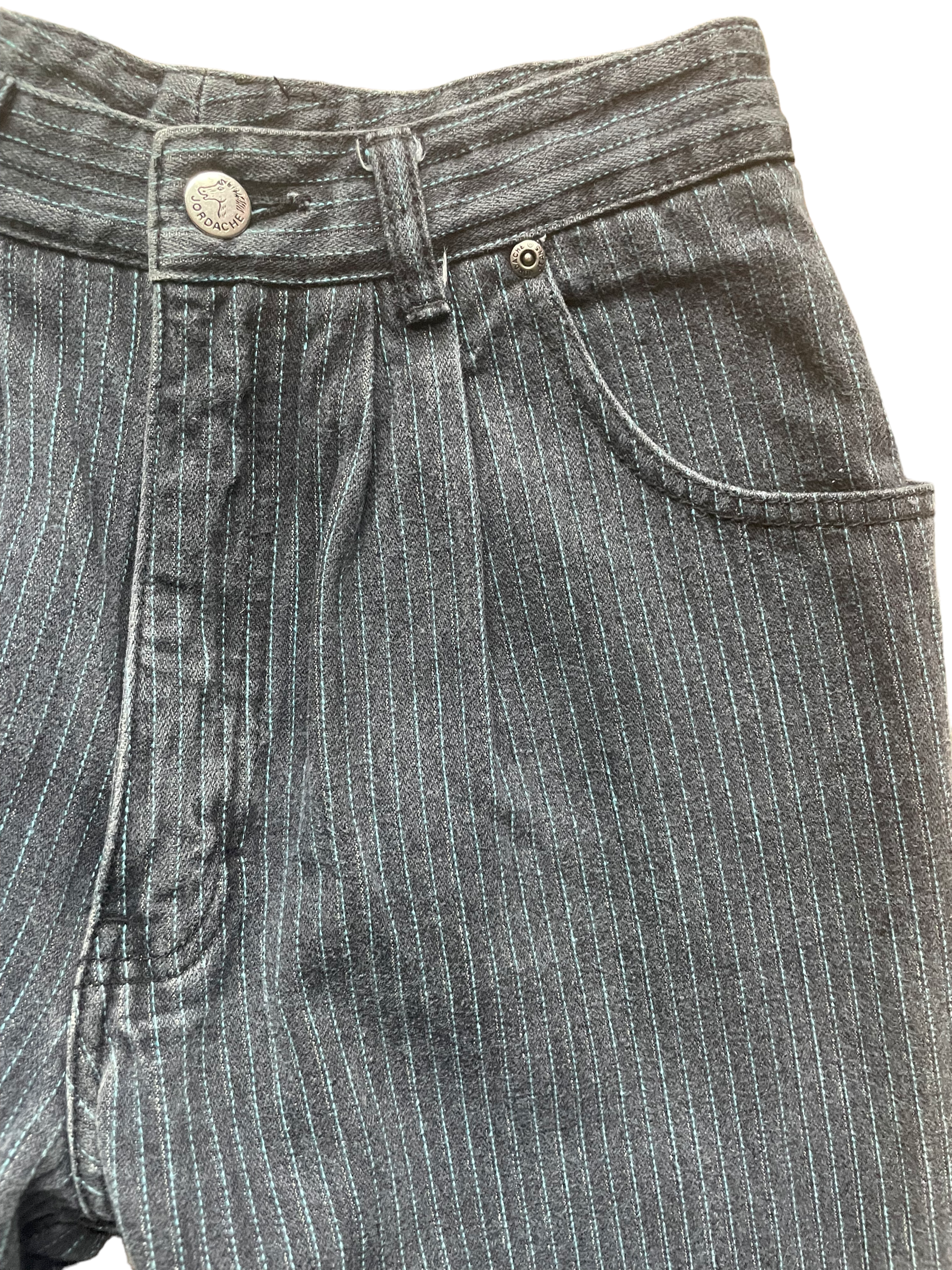 Front left side waist view of Vintage 1980s Grey/Blue Pinstriped Jordache Jeans | Barn Owl Seattle | Vintage Ladies Jean and Pants