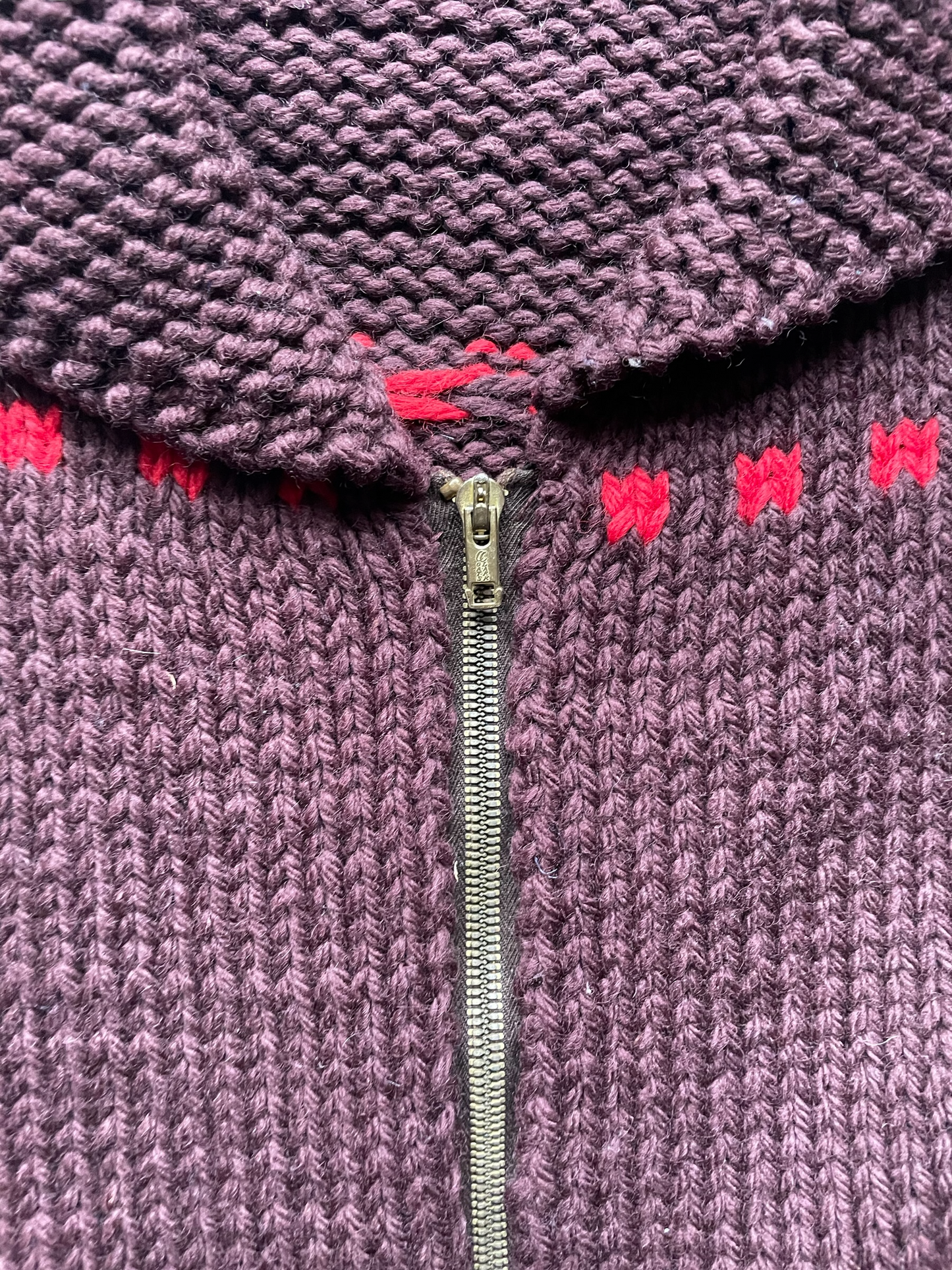 Close up of zipper pull on the vintage brown cowichan style sweater. seattle vintage clothing. 