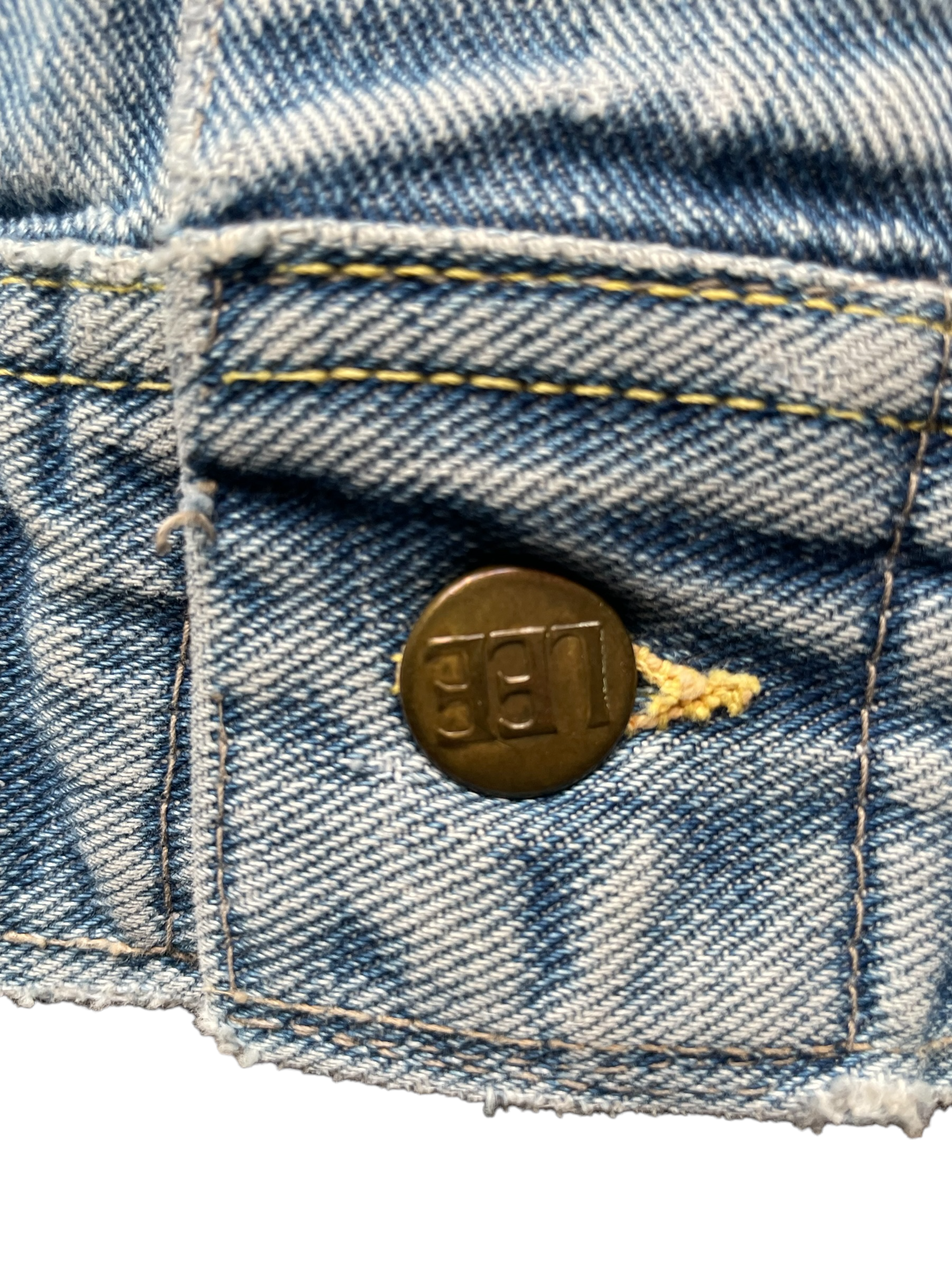 Close up of button on the Vintage Lee Jacket.  Seattle Vintage Clothing. 