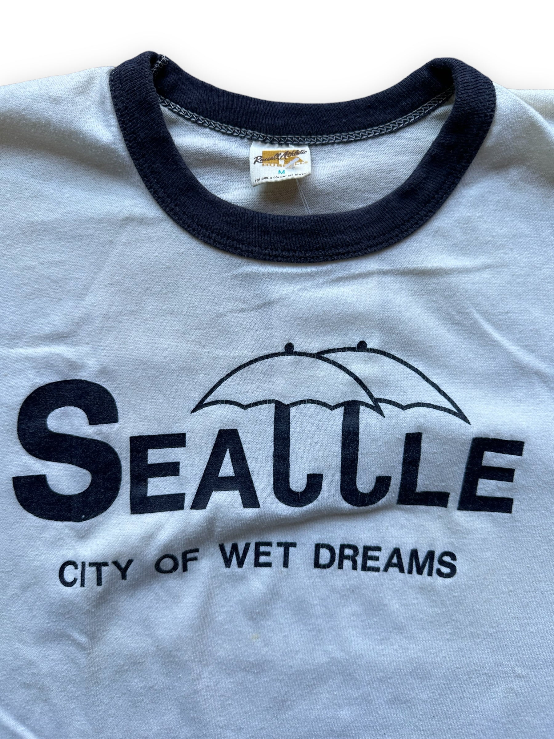 Tag View on Vintage Seattle City of Wet Dreams Ringer Tee SZ M |  Vintage Russell Athletic T Shirt | Barn Owl Vintage Seattle